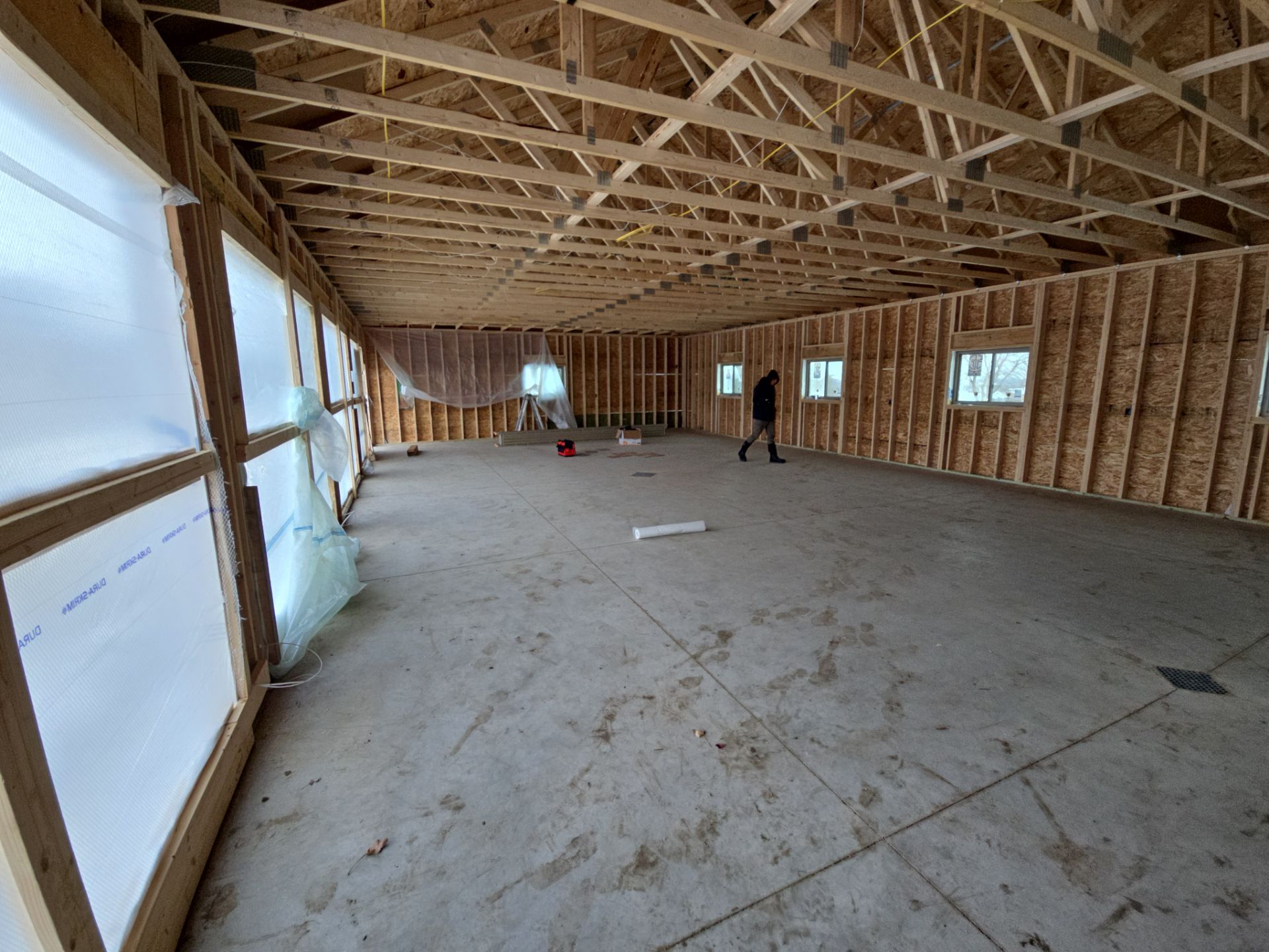 Speckled Epoxy Floor Coating for Large Shop in Rock Valley by Select Painting, Coatings & Garage Cabinets