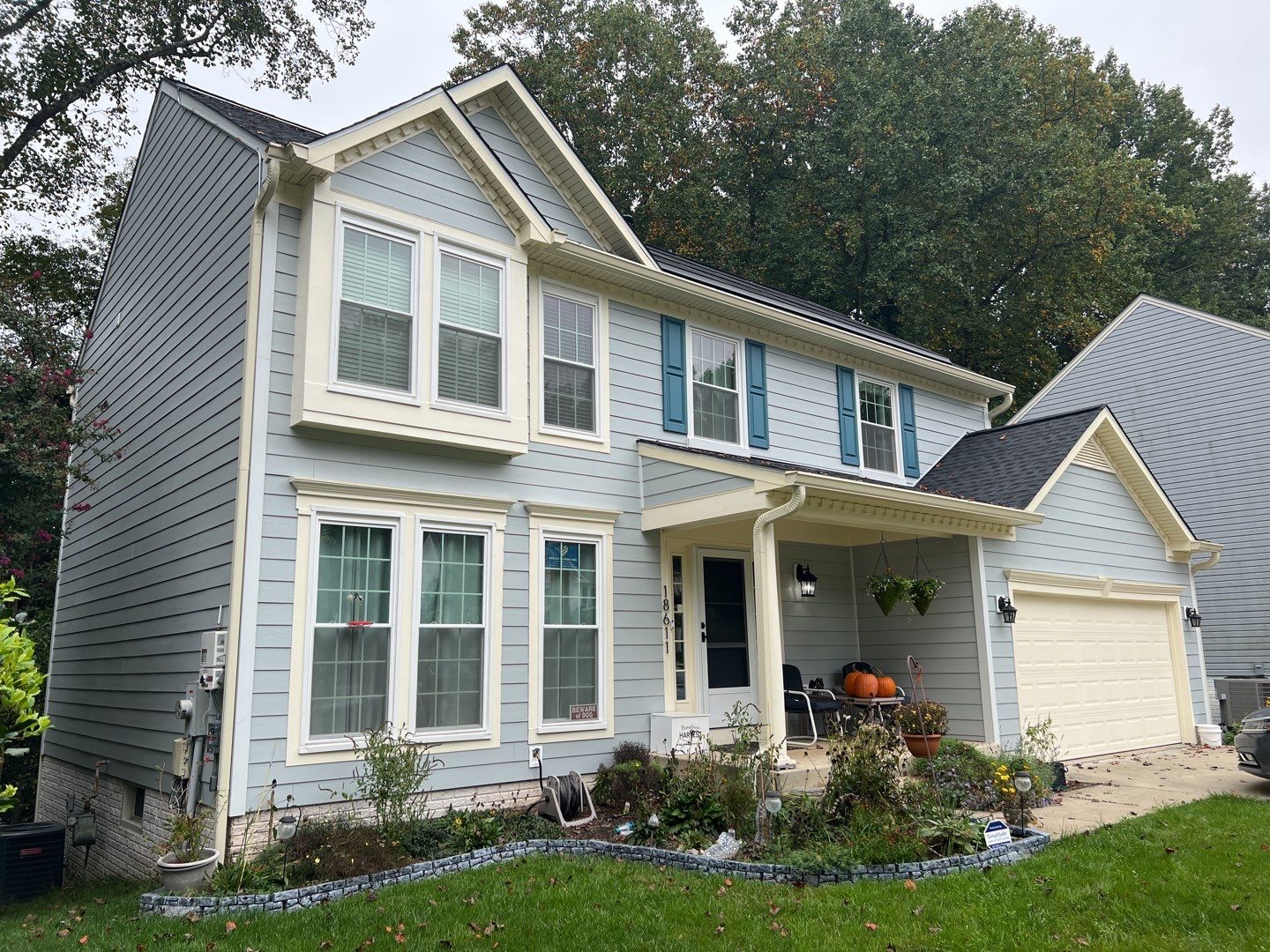 Exterior Home Makeover using GAF Timberline HDZ, GAF Decotech, and James Hardie Siding by American Home Contractors