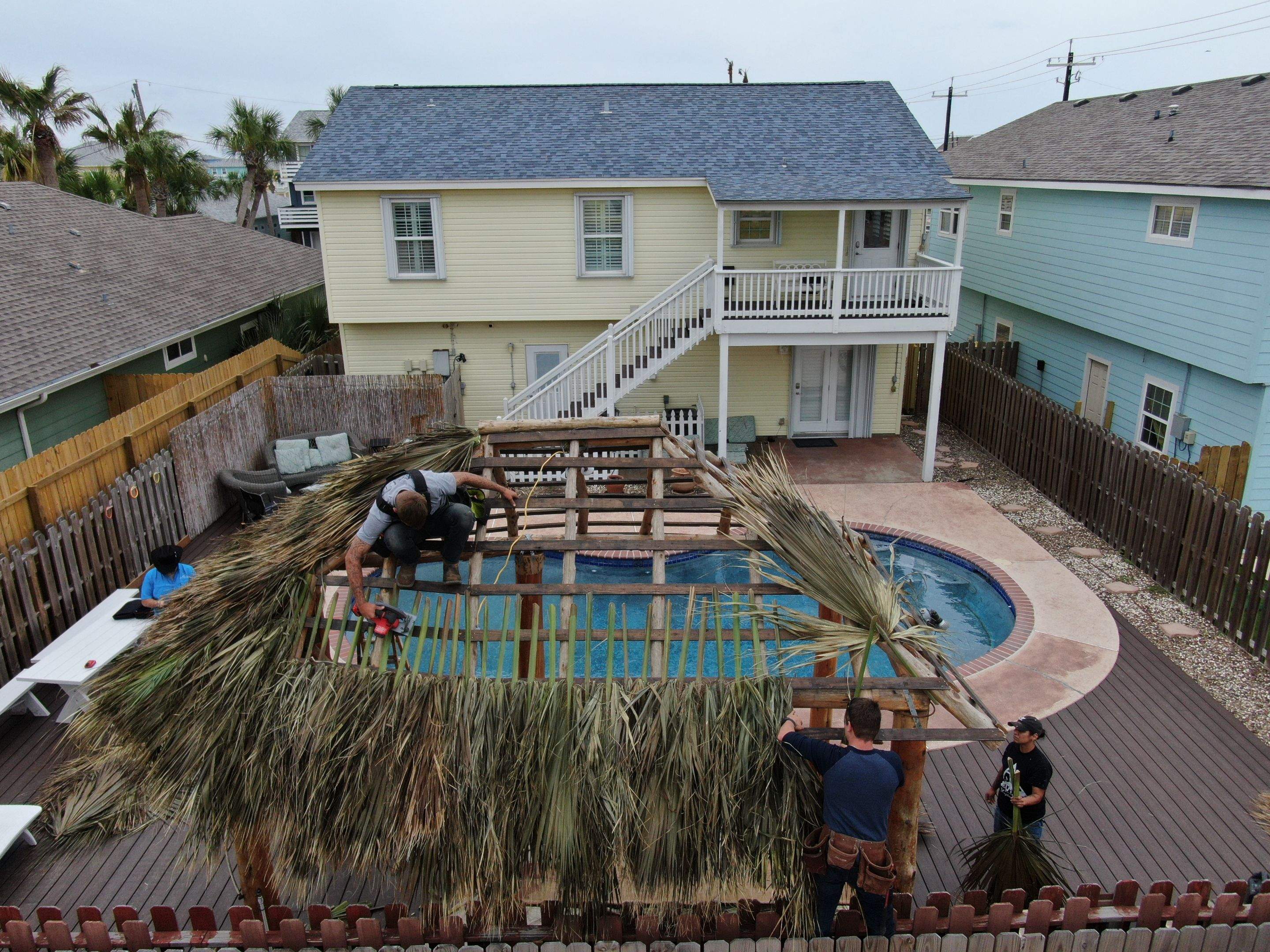 Poolside paradise by Bayfront Roofing and Construction