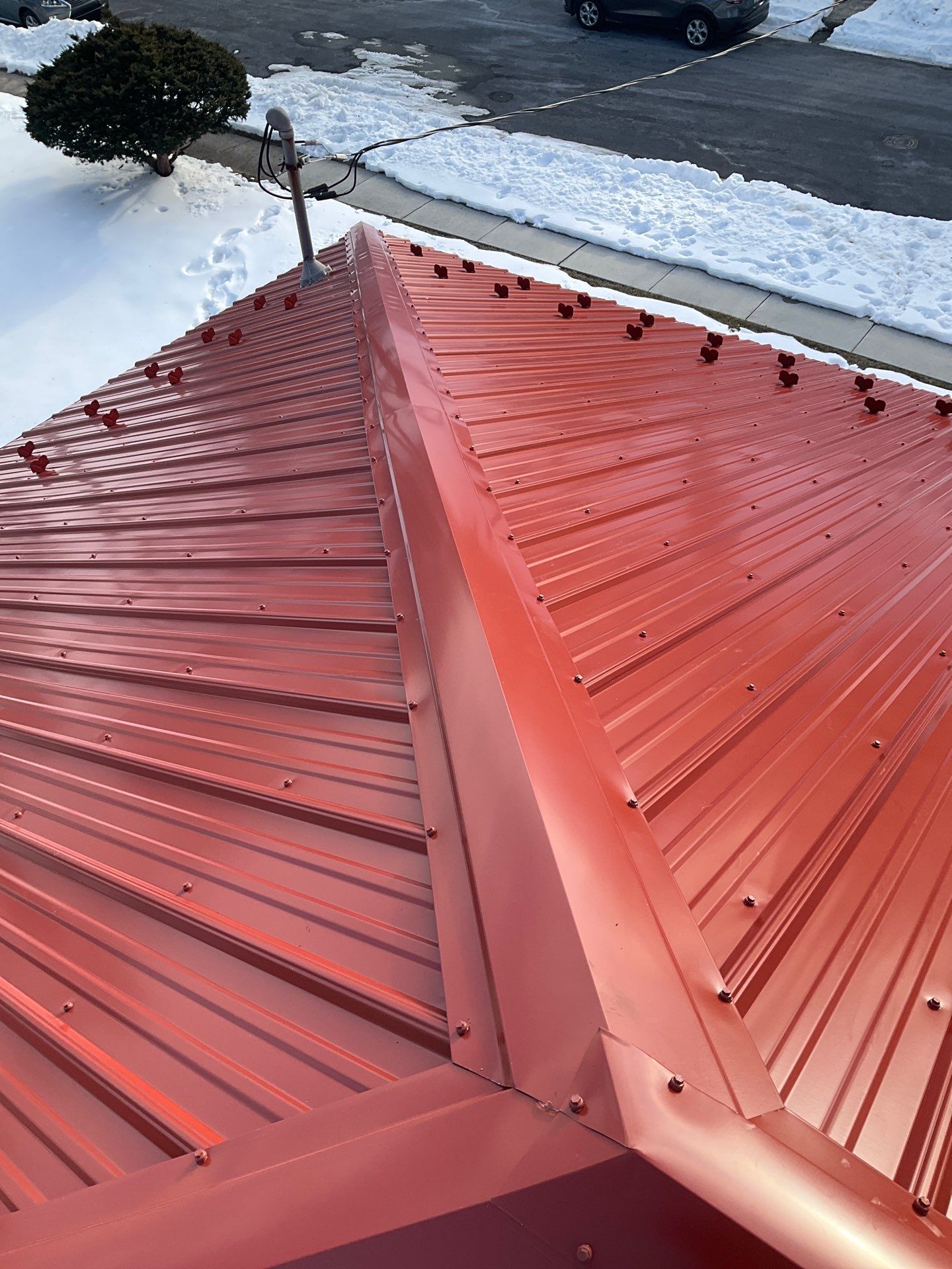 Red Metal Roofing Upgrade for Brick Home by Esh Builders