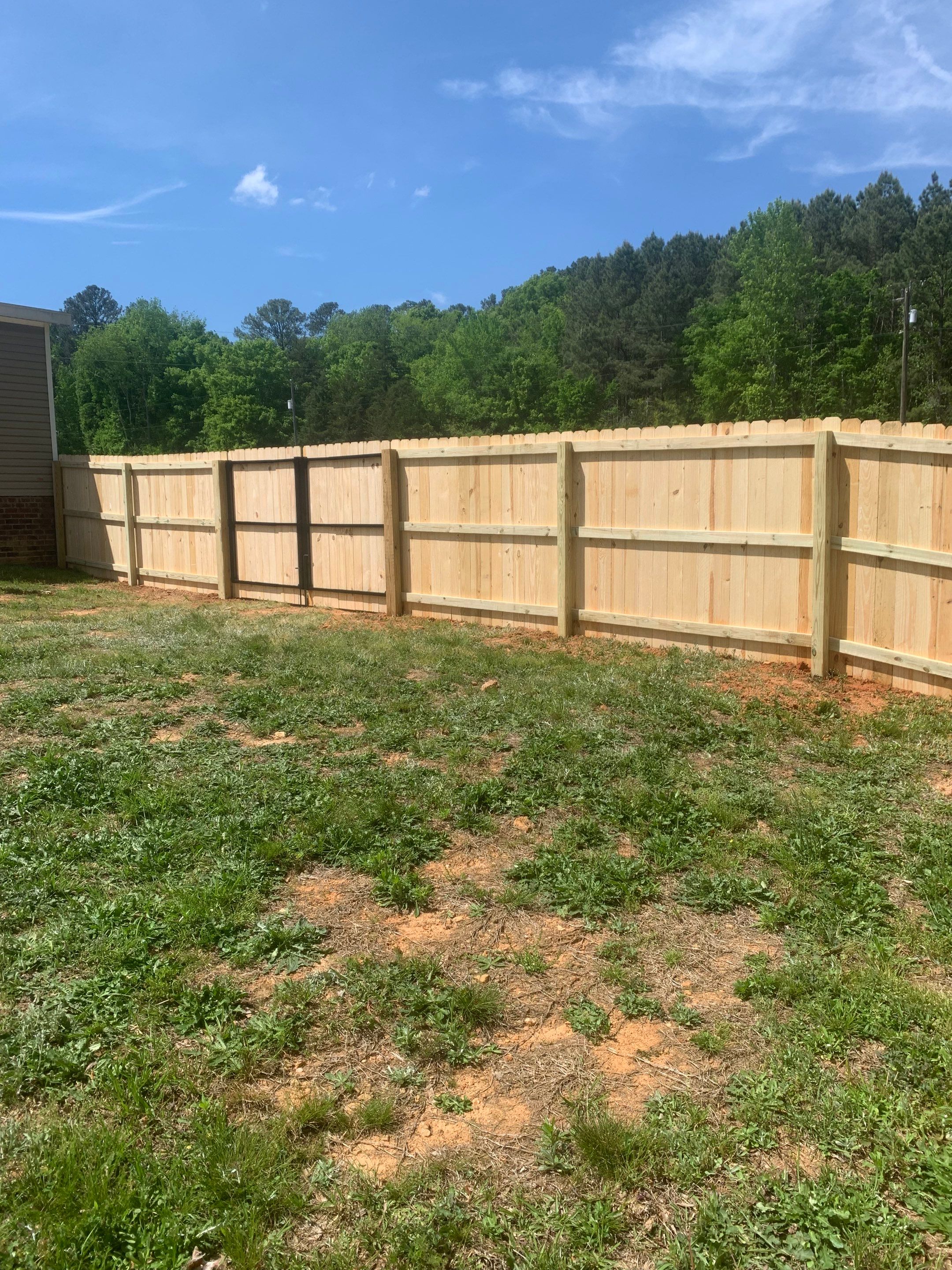 Stockade Wood Project in Roanoke Rapids by Superior Fence and Rail