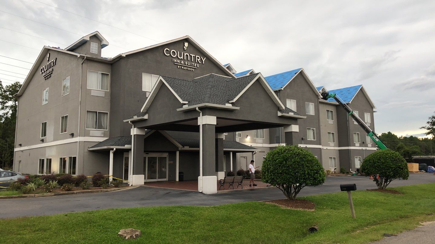 Commercial Roofing Installation using Roof Replacement by American Roofing & Construction LLC