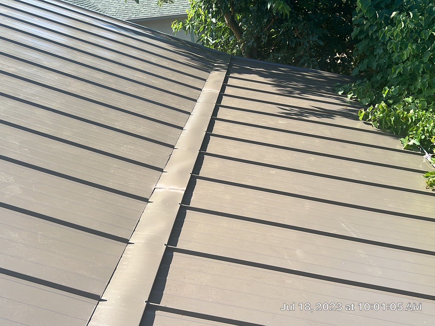 Metal roofing installation using ASC Standing Seam metal by Straight Edge Roofing Inc
