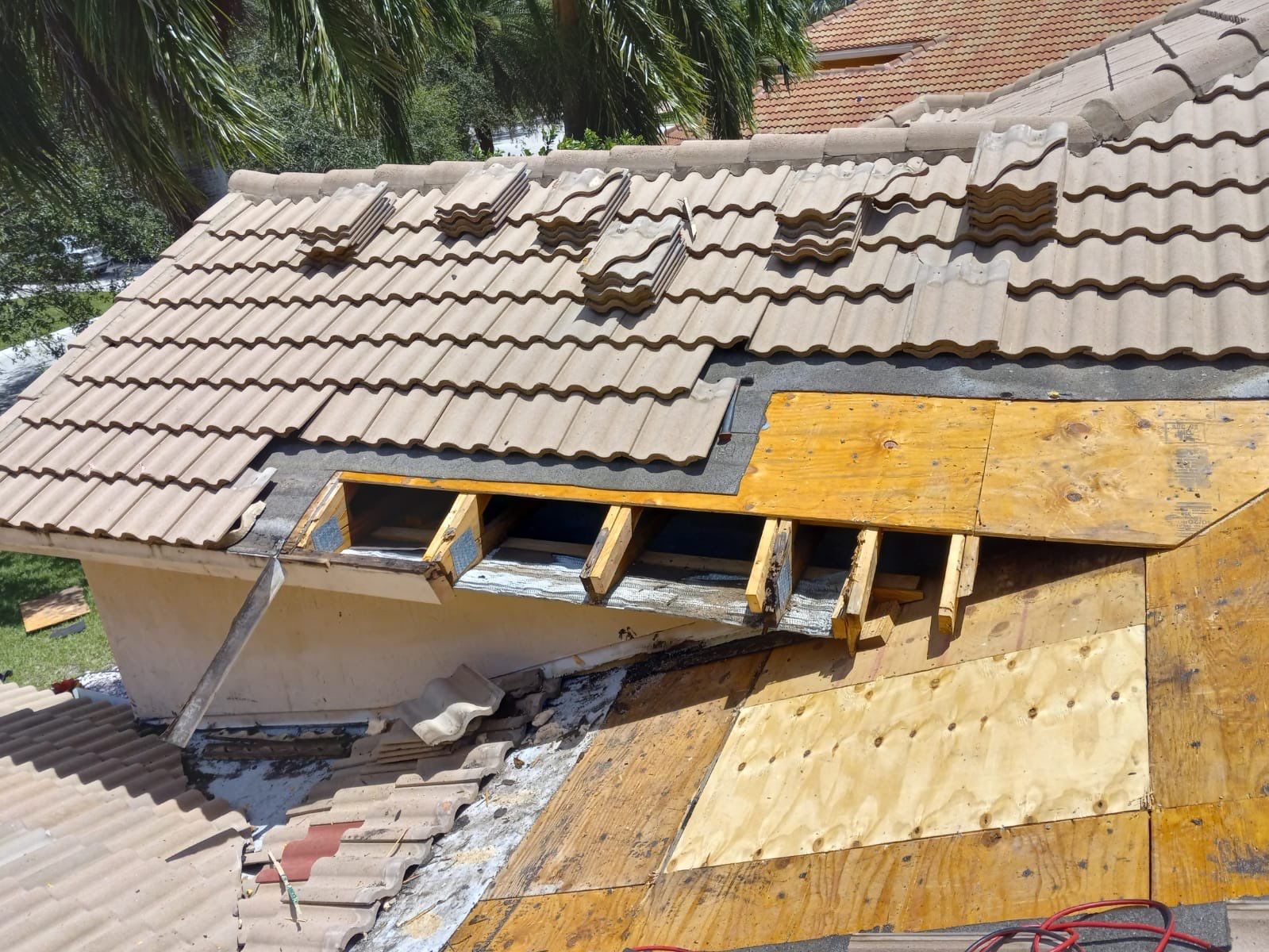 Concrete Tile Roof Leak Repair and Wood Decking Replacement in Parkland by Aastro Roofing