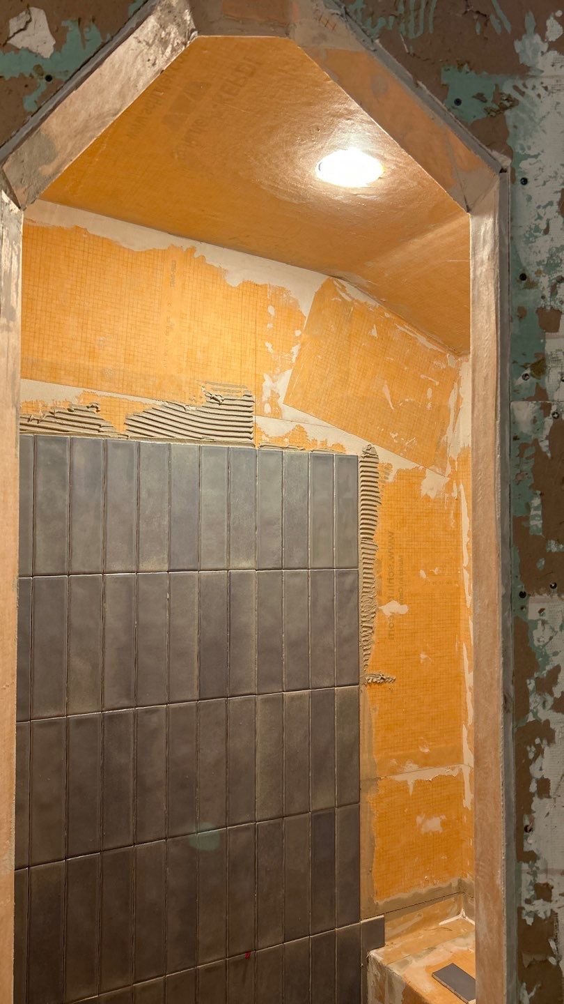 Tile shower and floor by Footprints Floors of Nashville