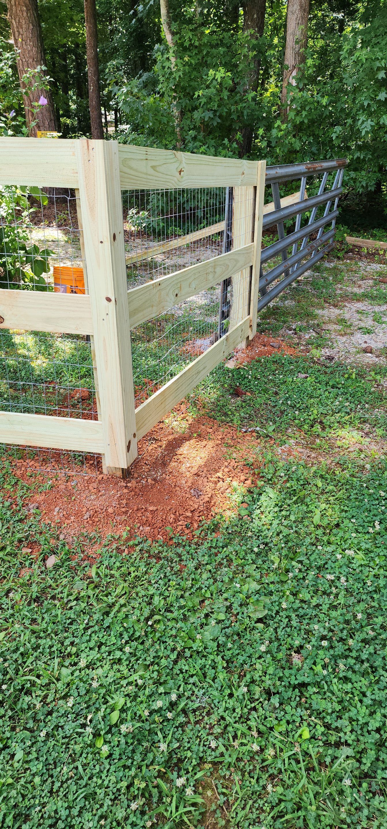 Fence Installation of 3 Rail Ranch with Wire Backing by Titans of Timber Fence & Stain