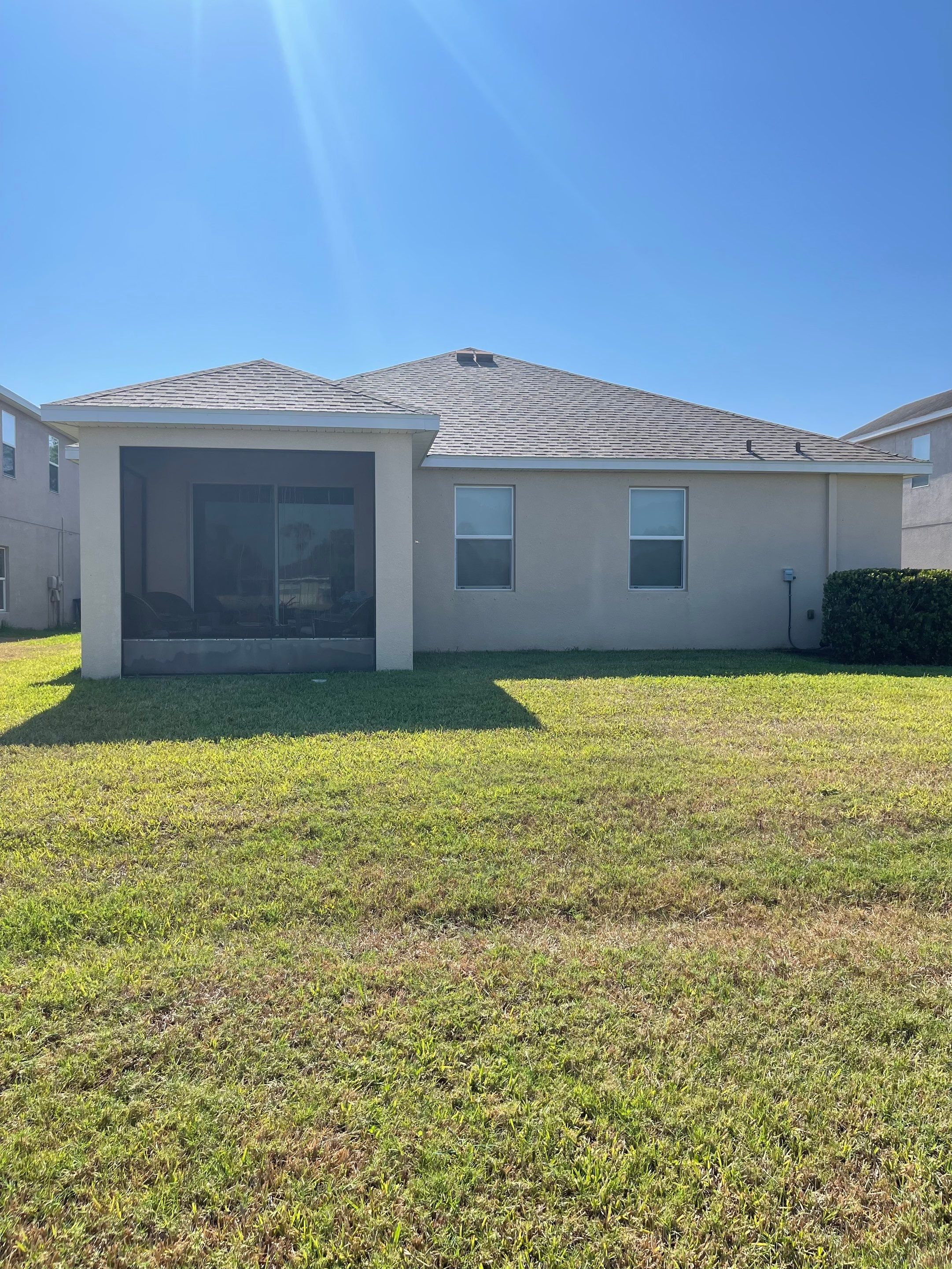 Asphalt Shingle Roof Soft Wash Cleaning & Concrete Pressure Washing in CopperStone Community, Parrish, FL by Sunshine AquaWash