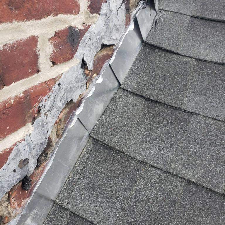 New Roof & Gutters by Island Roofing Inc.