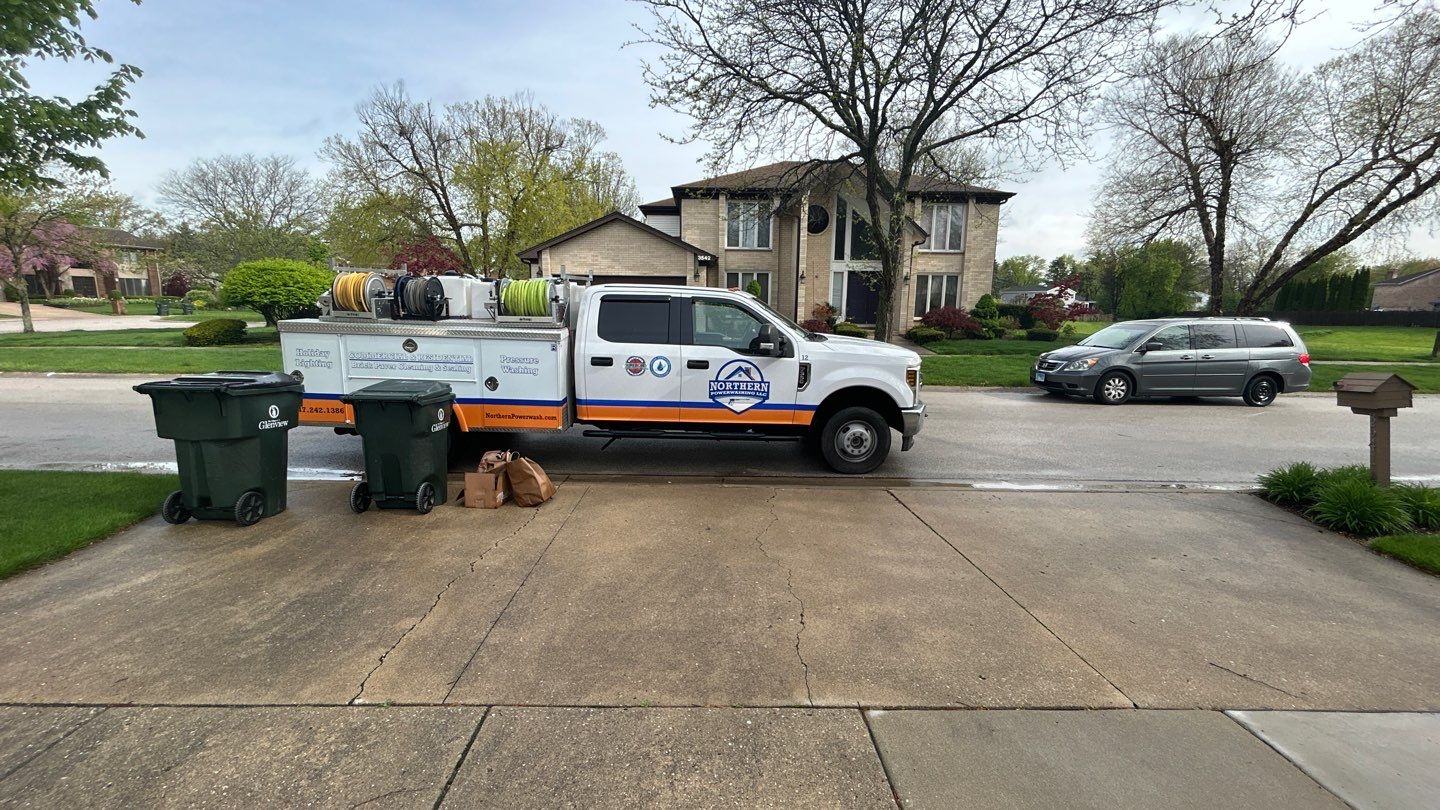 concrete patio and driveway cleaning by Northern Power Washing LLC.