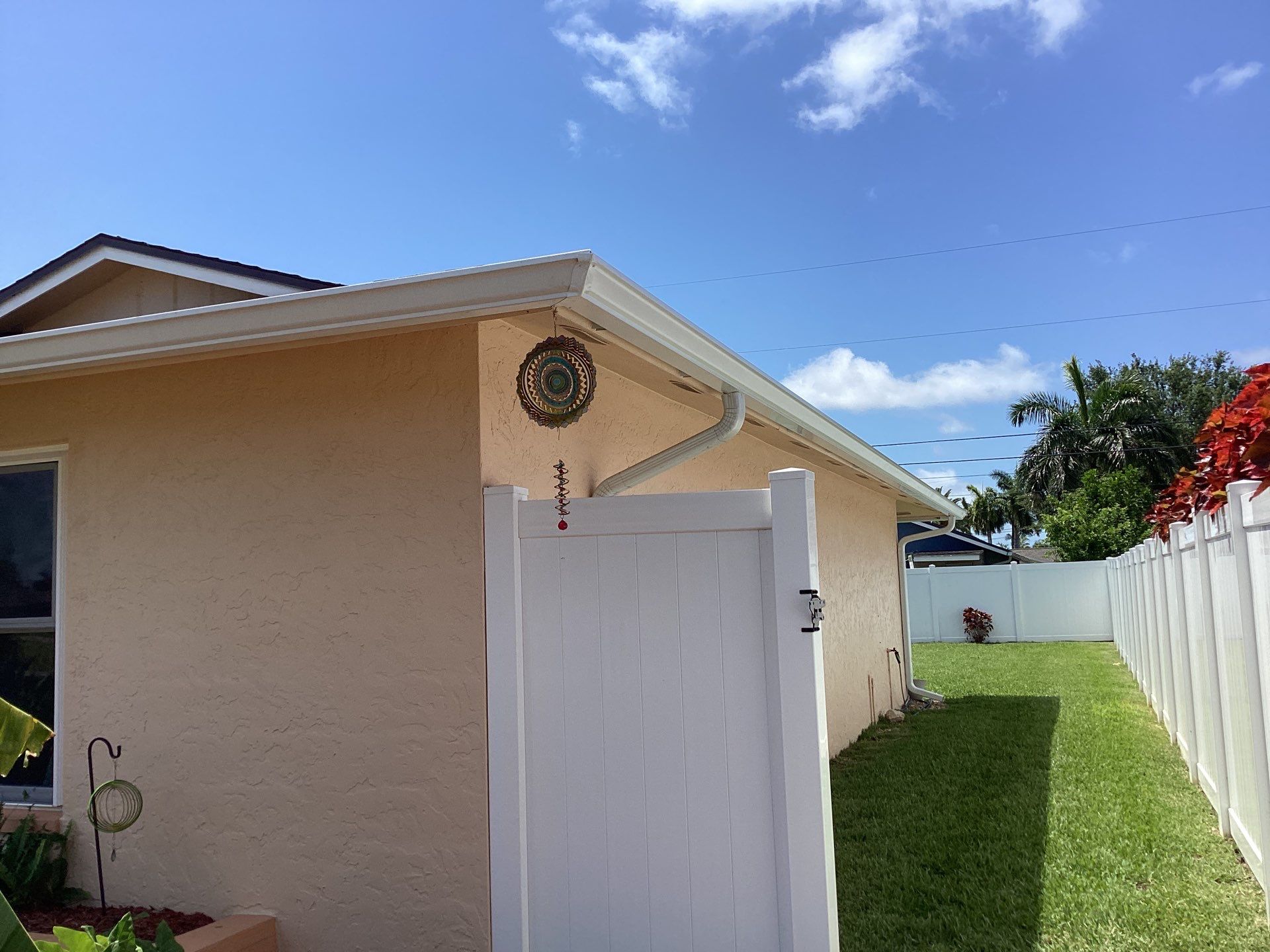 White K Style Seamless Gutters using 3X4 Elbow Downspout in Cape Coral FL by Gutter Professors
