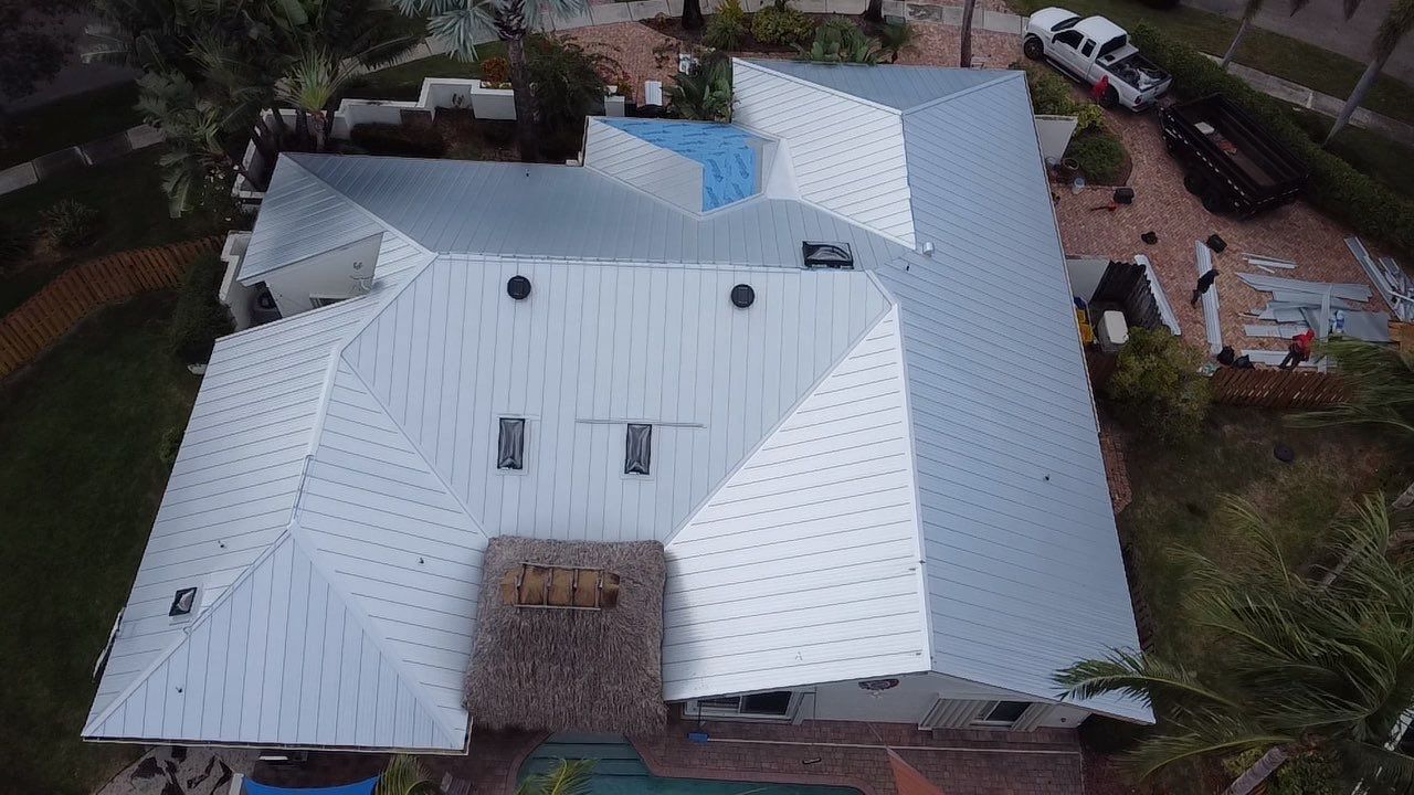 Residential Roofing Installation using 1" Nail strip metal roof by BLUES BROTHERS CONSTRUCTION CORP