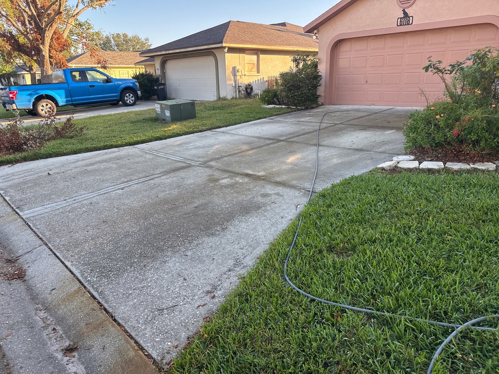 Concrete Driveway, Entryway, Flowerbed Curbing & Statue Cleaning in Heather Glen, Palmetto, FL | Sunshine AquaWash by Sunshine AquaWash