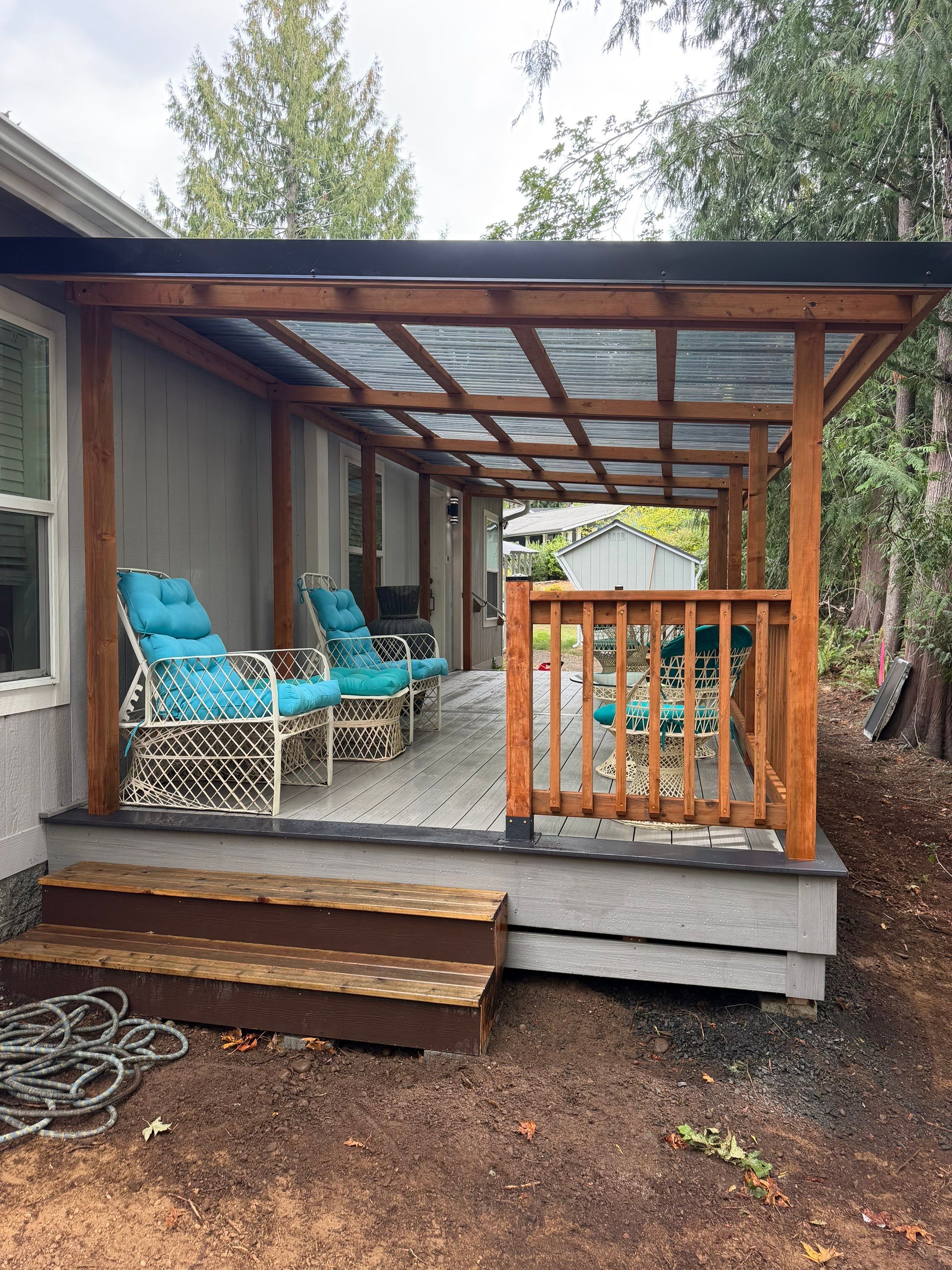 Covered Composite Deck with Translucent Pergola Roof in Port Orchard by Expedeck