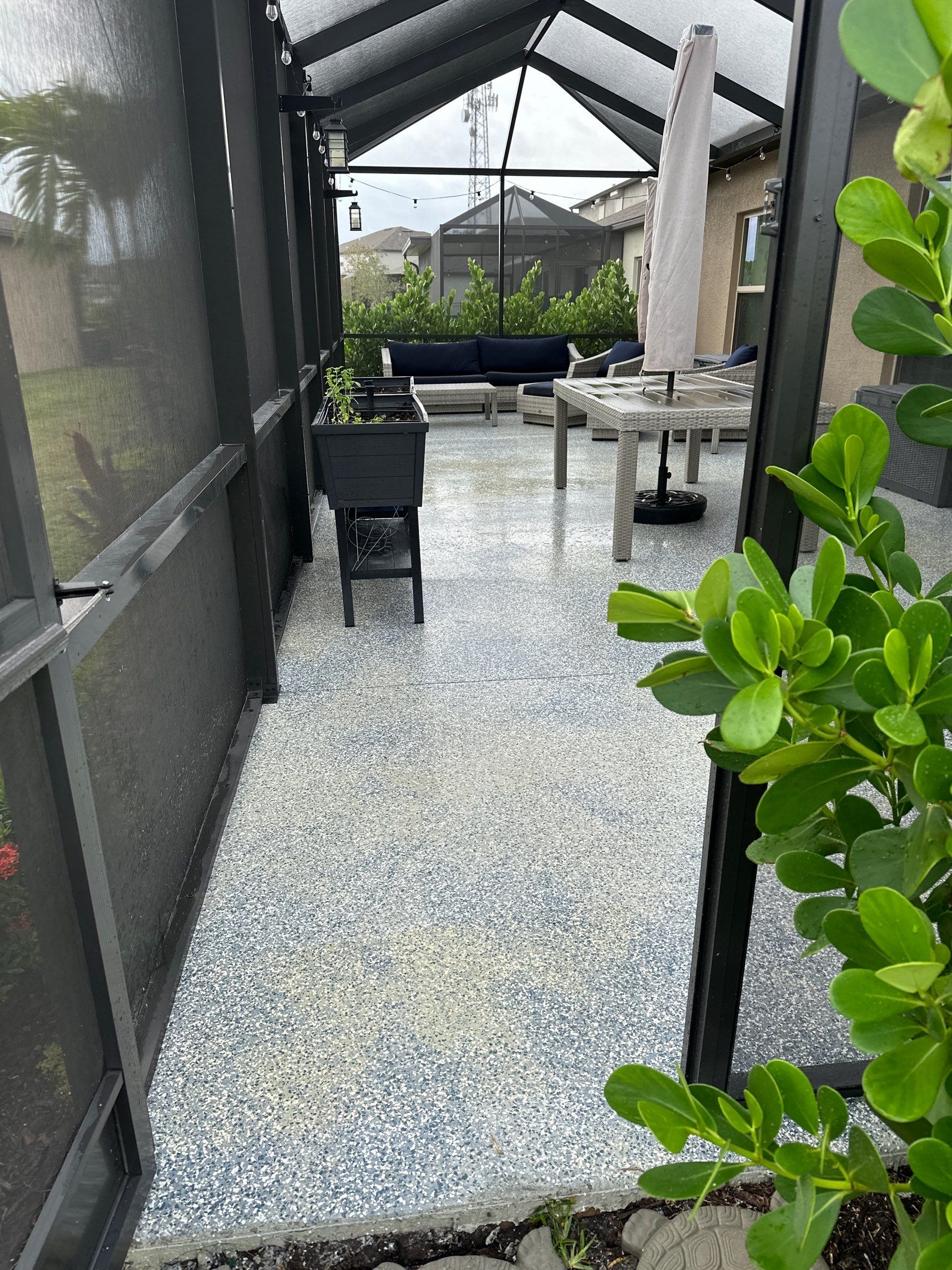 Lanai & Patio Cleaning with Epoxy-Coated Concrete Floor in Trevesta Community, Palmetto, FL | Sunshine AquaWash by Sunshine AquaWash
