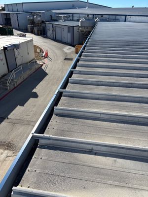 View along the edge of a completed metal roof