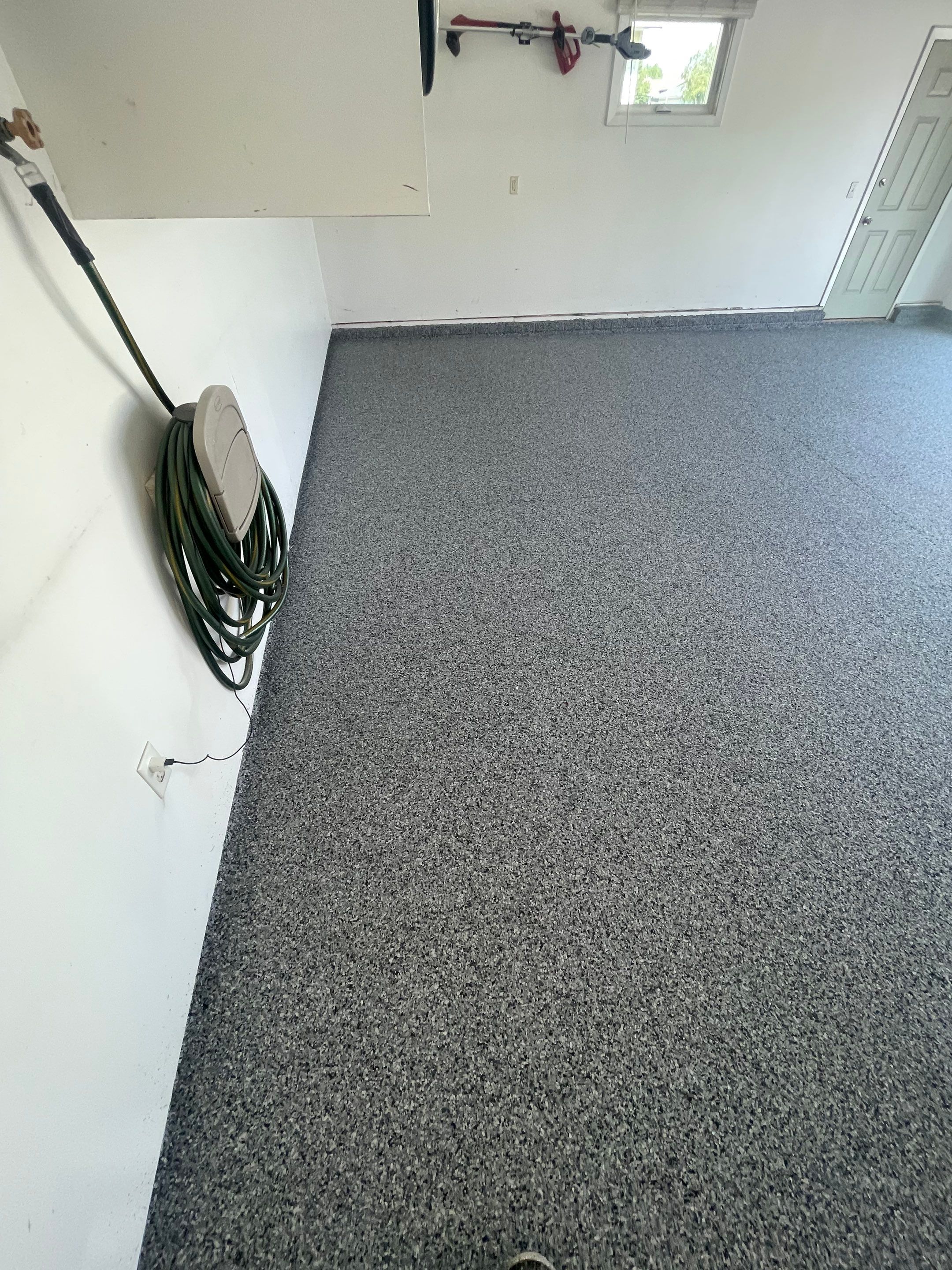 Sioux Falls Garage Floor Coating with Nightfall Decorative Chips by Select Painting, Coatings & Garage Cabinets