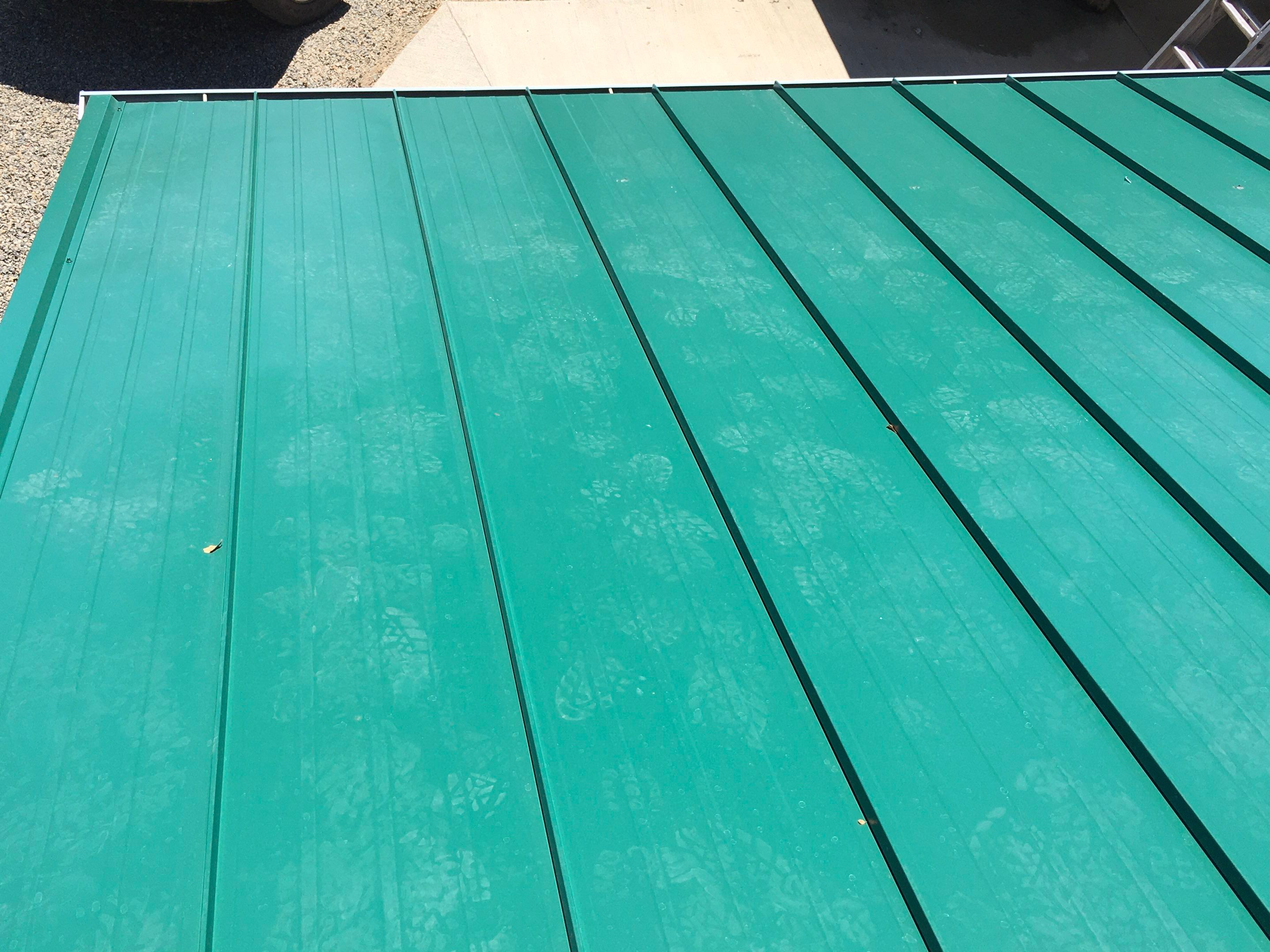 Metal roofing installation using Standing seam metal roofing system by Straight Edge Roofing Inc