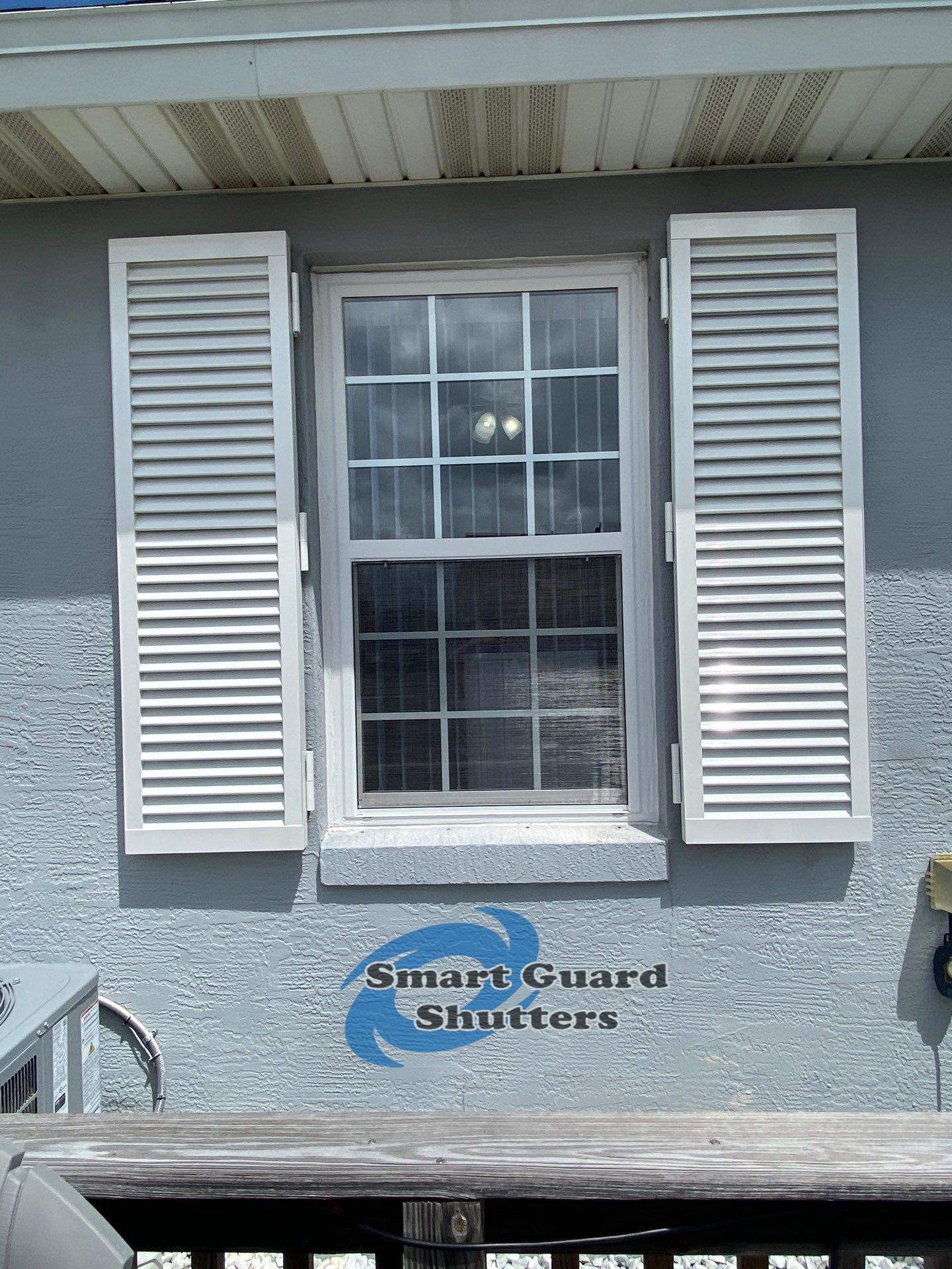 Impact Colonial Shutters in Signal White by Smart Guard Shutters