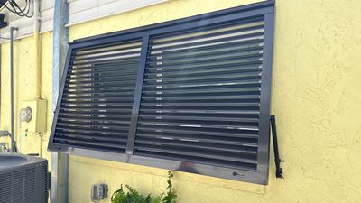 Hurricane Rated Bahama Shutters in Grey Brown