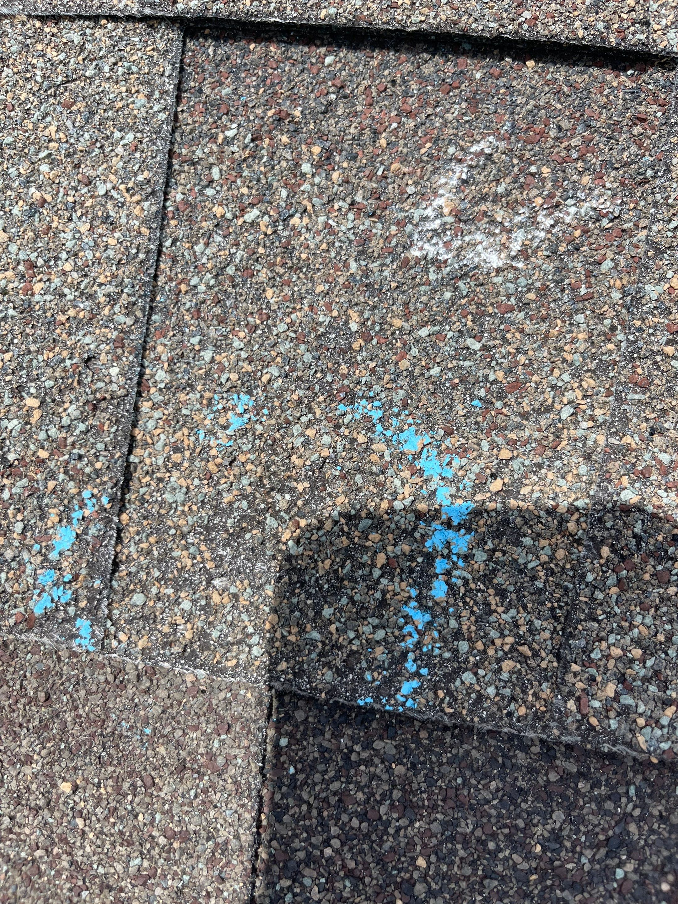 Hail Damage on a Roofing System by Icon Roofing And Construction 