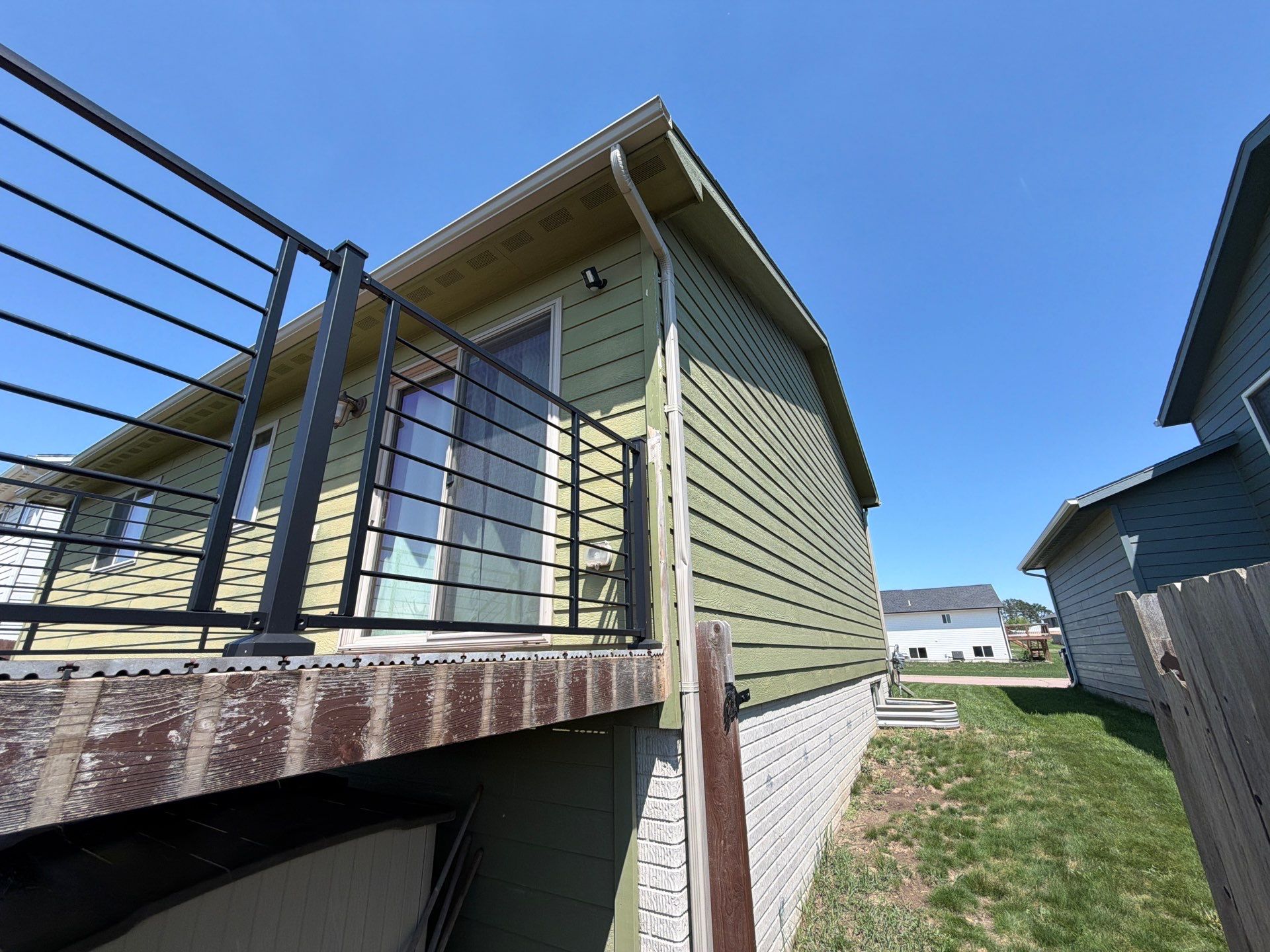 Exterior Painting and Custom Deck Construction in Sioux Falls by Select Painting, Coatings & Garage Cabinets