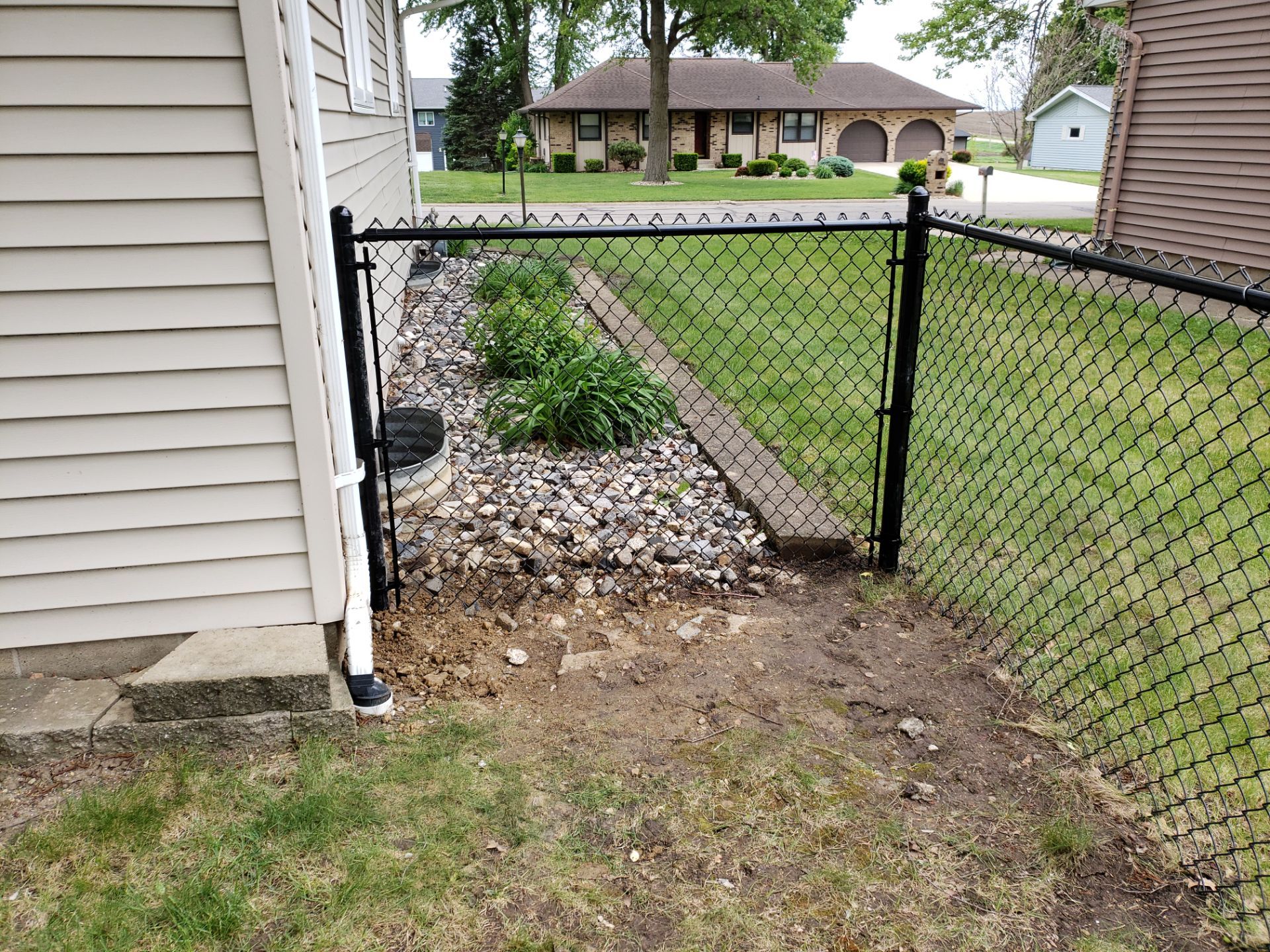 Chain Link and Cedar Privacy in Grundy Center by Perfect Picket Fence and Stain