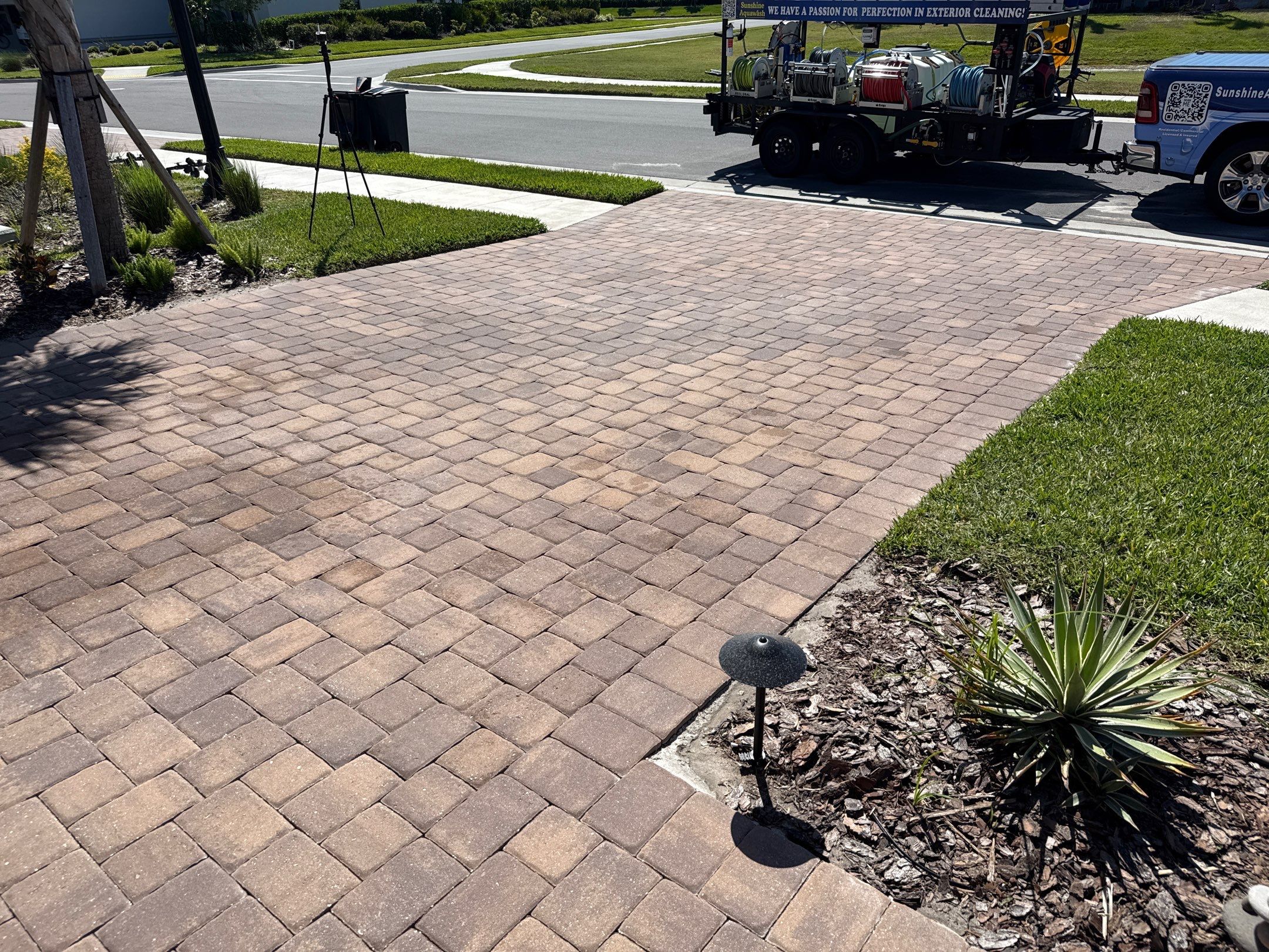 Oil Stain Removal on Paver Driveway | Esplanade at Artisan Lakes, Palmetto FL by Sunshine AquaWash