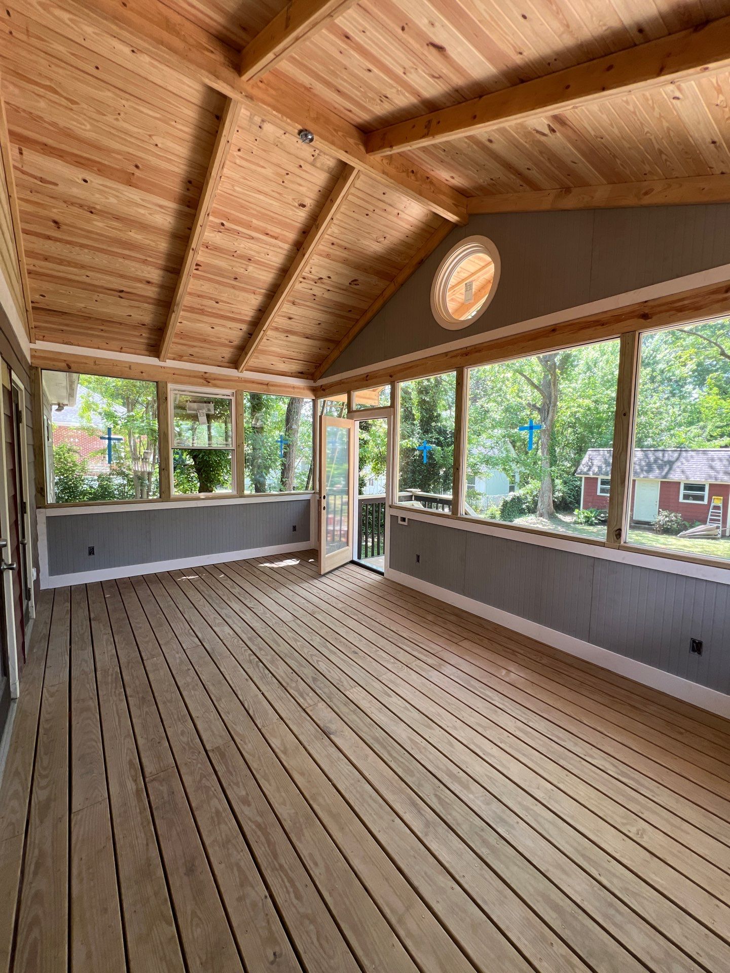 Elevated Screened-In Porch Addition with Vaulted Tongue-and-Groove Ceiling by Swift Home Renovations