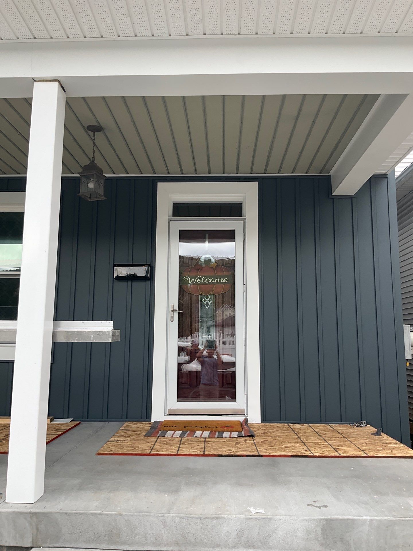 Charcoal Metal Roof & Blue Siding — A Refreshing New Look by Esh Builders