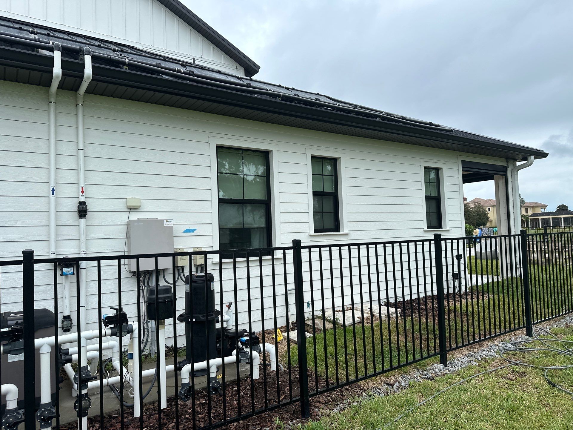 Complete Two-Story House Wash and Driveway Cleaning in Winding River Community, Bradenton, FL by Sunshine AquaWash