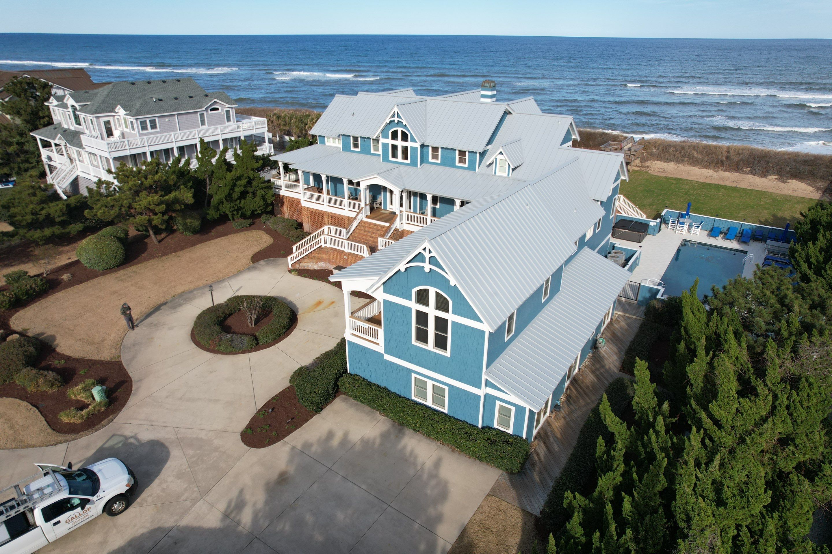 Large Metal Roof Transformation by Gallop Roofing & Remodeling, Inc.