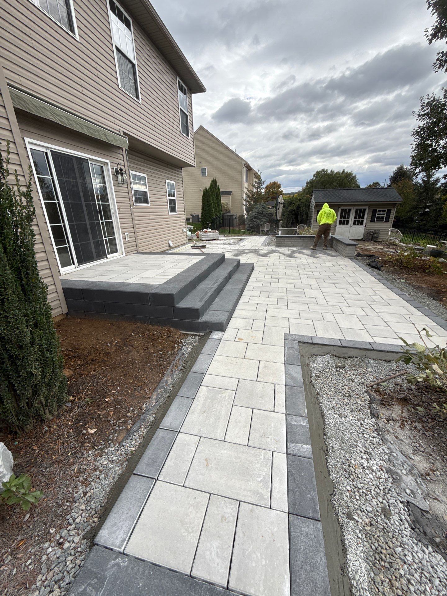 Backyard Retreat: Techo-Bloc Patio + Firepit Lounge by Saylor’s Lawn & Landscape