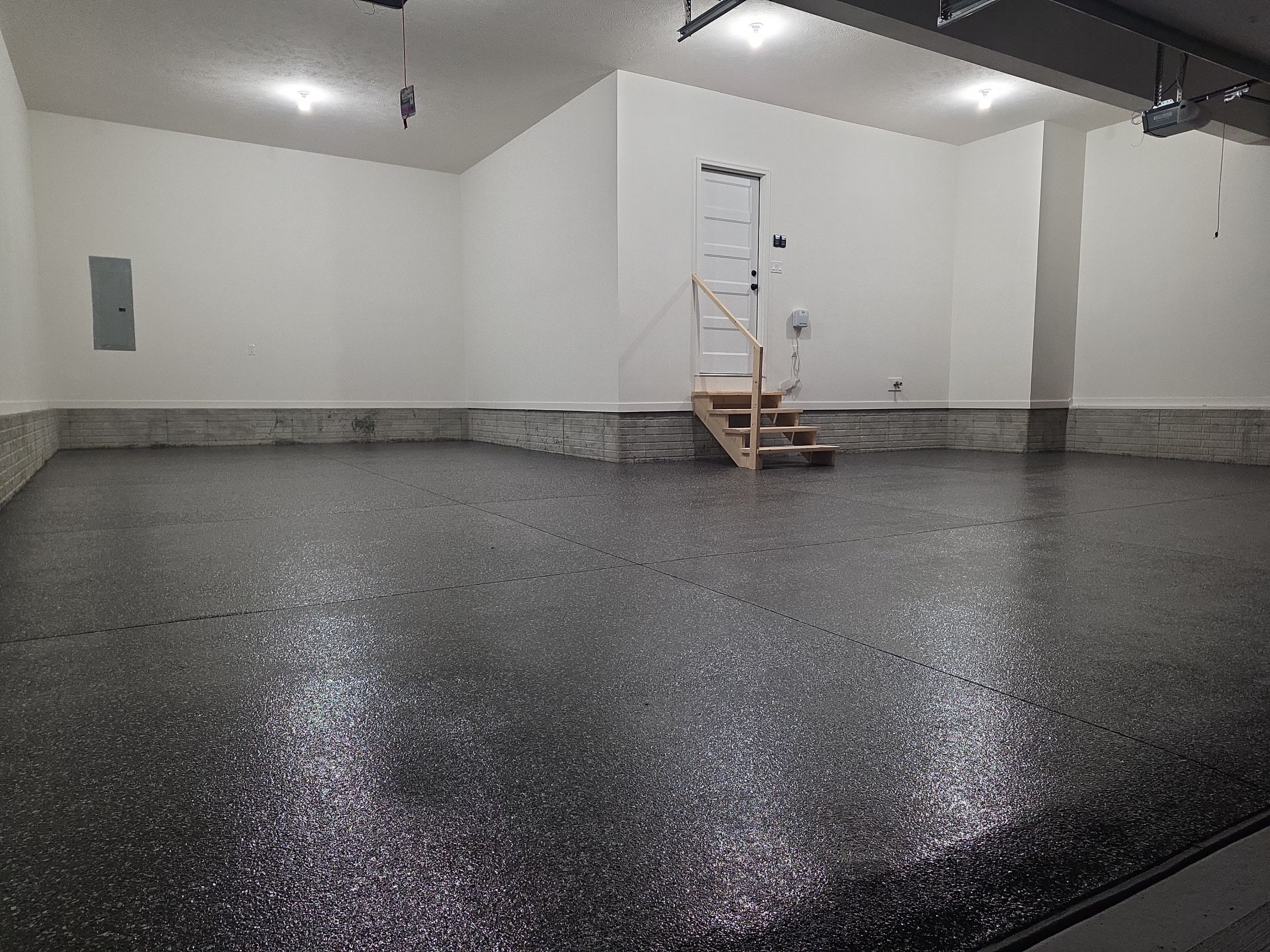 Husker-Style Garage by Revival Concrete Coatings