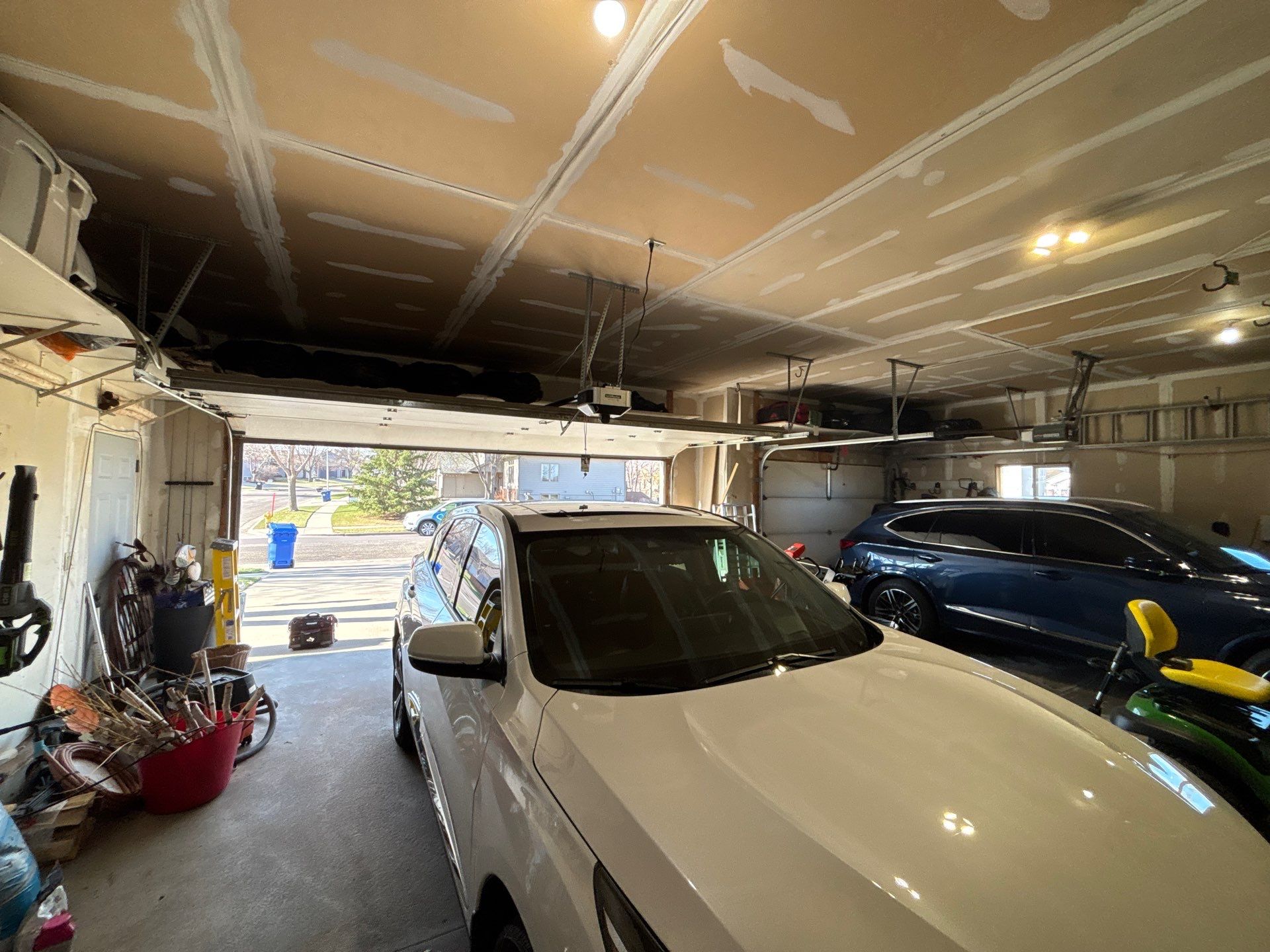 Sioux Falls Garage Concrete Repair and Epoxy Flake Floor Coating by Select Painting, Coatings & Garage Cabinets