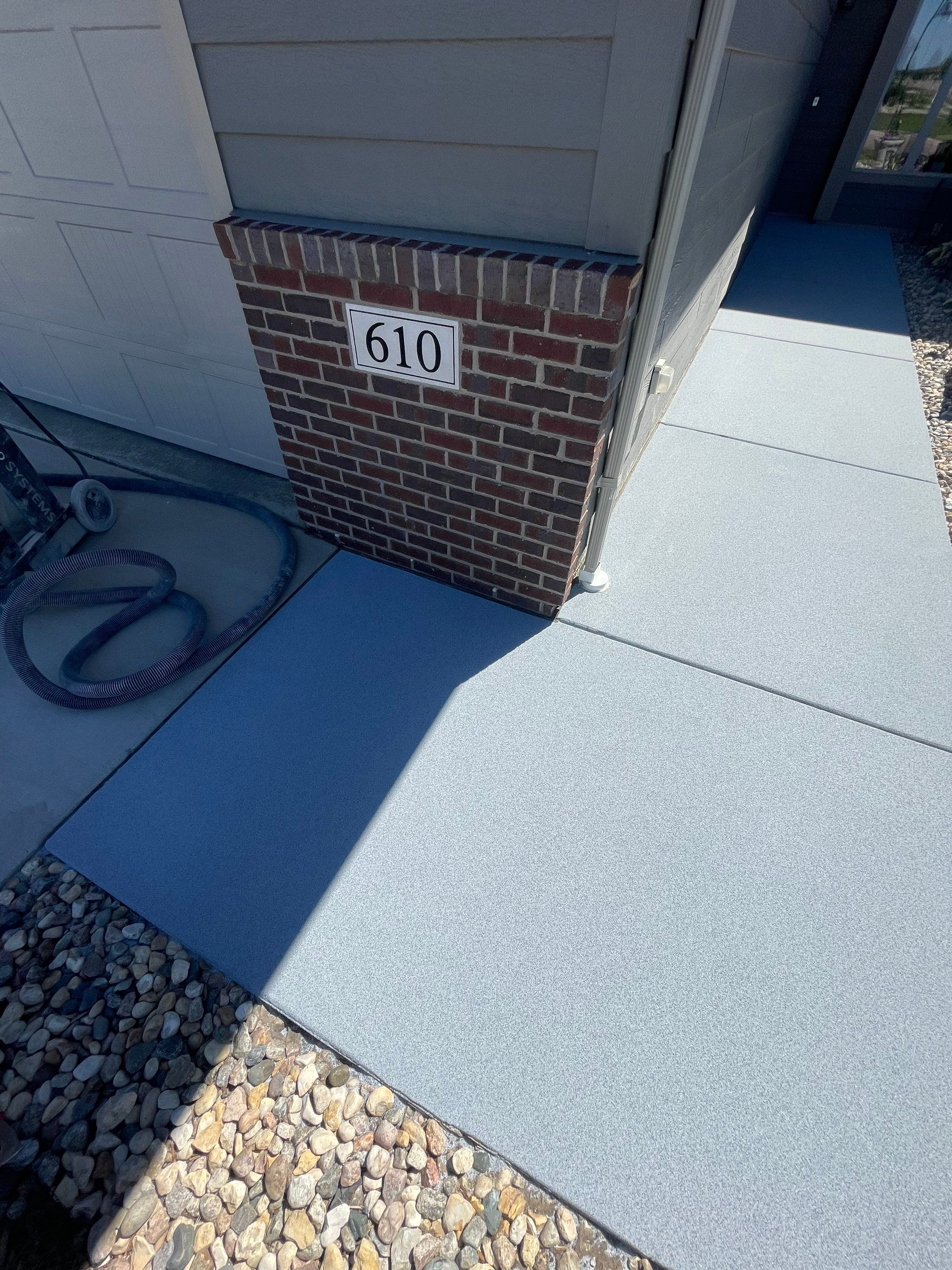 Custom Concrete Coating for Sioux Falls Patio and Front Walkway by Select Painting, Coatings & Garage Cabinets