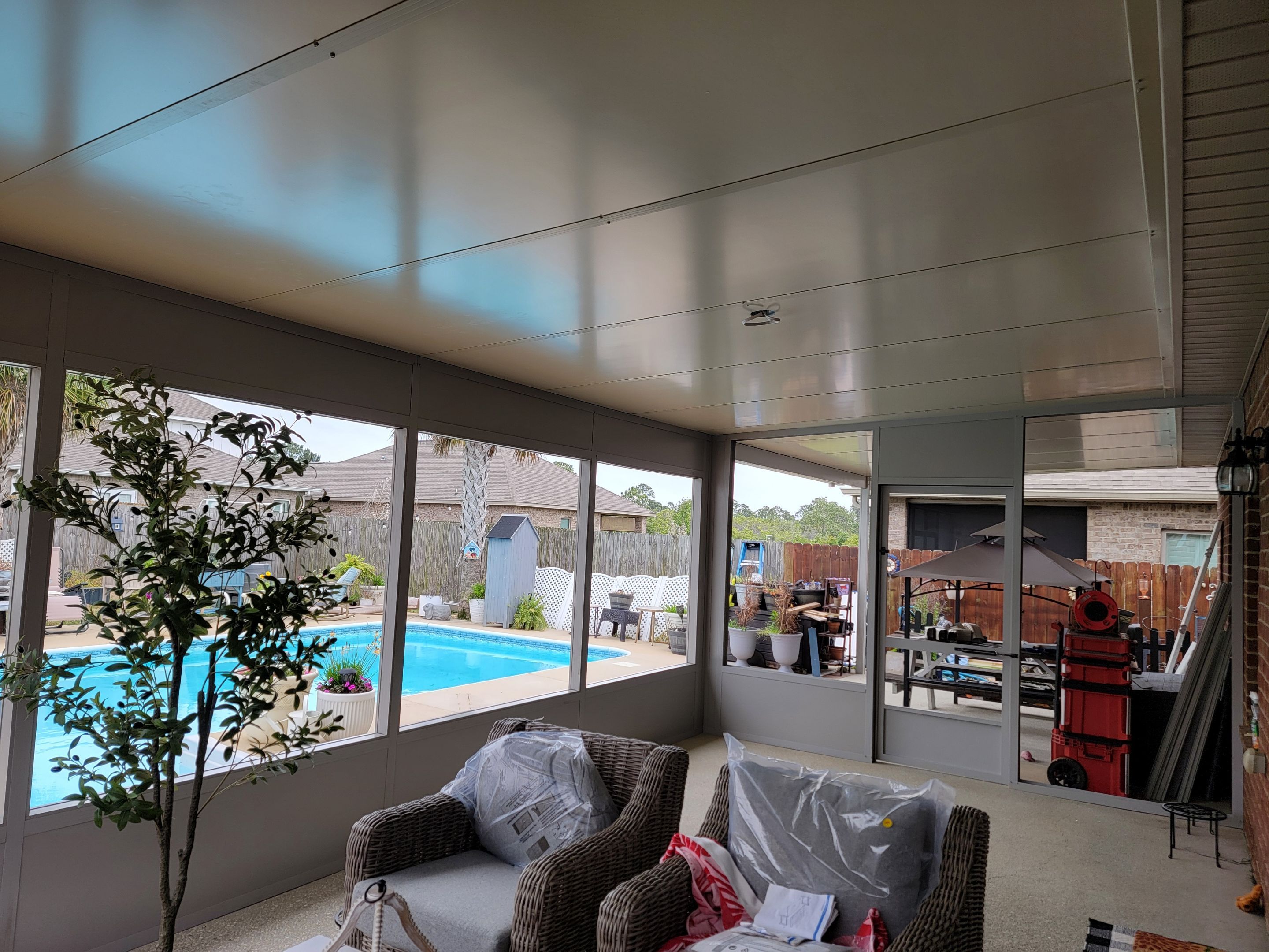 Poolside Screen Room & Patio Cover in Gulf Breeze by Titan Sunrooms