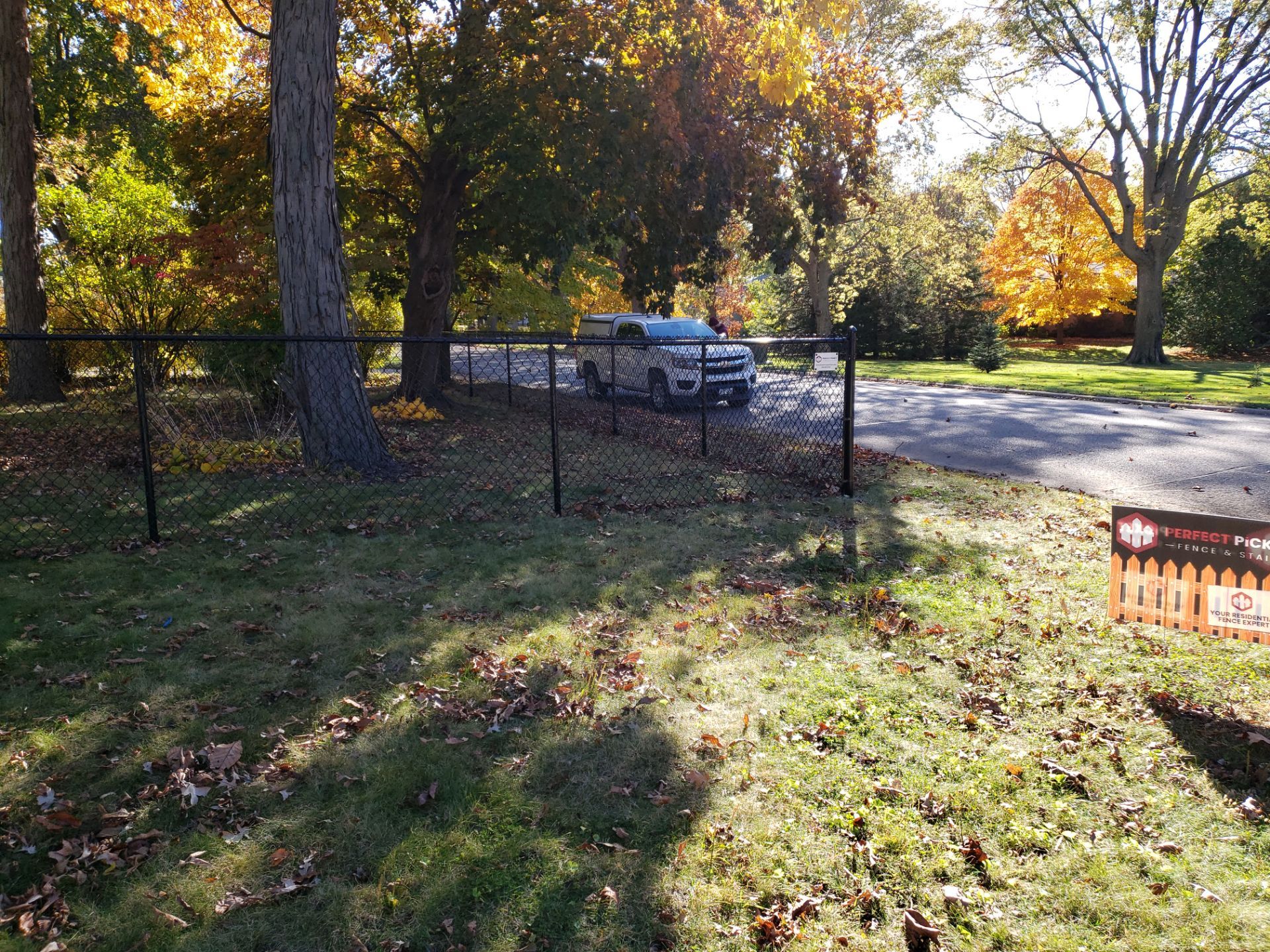 Black Chain Link Fence Installation in Cedar Falls, Iowa by Perfect Picket Fence and Stain
