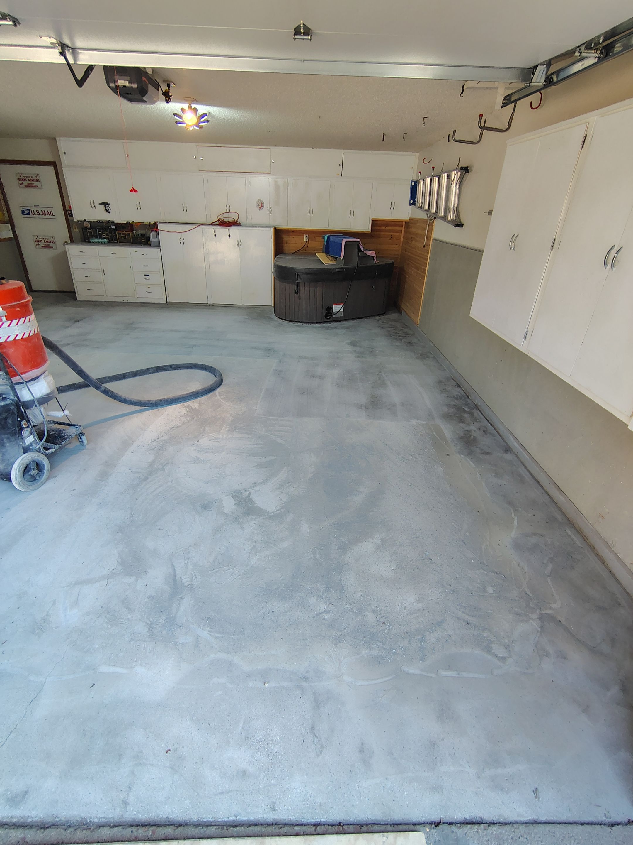 Domino Flake Garage Floor Coating Installation in Sioux Falls by Select Painting, Coatings & Garage Cabinets