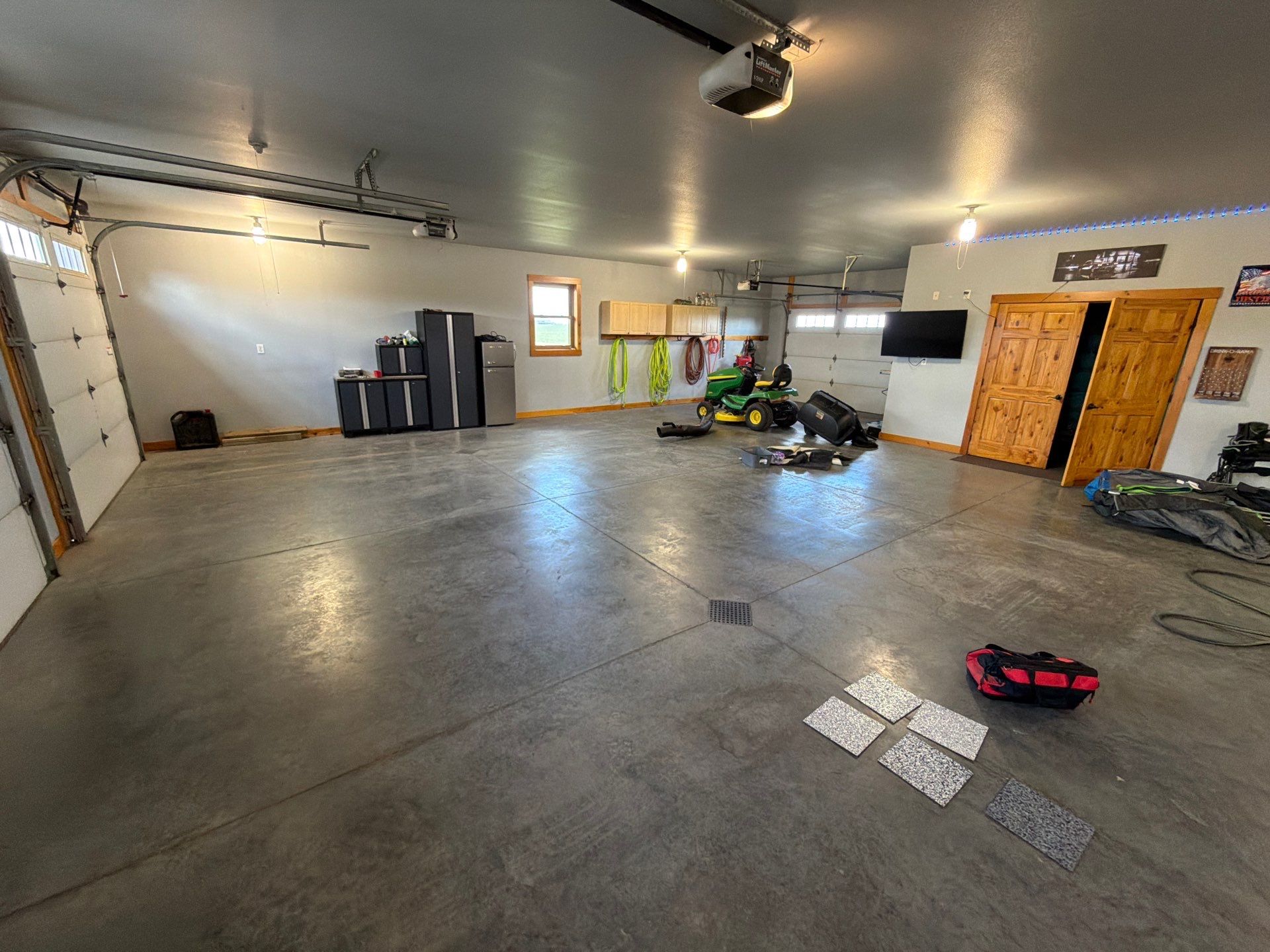 Multi-Car Garage Concrete Coating and Floor Refinishing in Hull by Select Painting, Coatings & Garage Cabinets