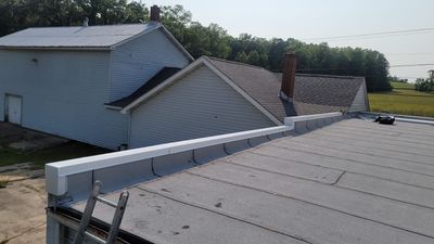 Roof Installation using Silicone APP Elevate Coating