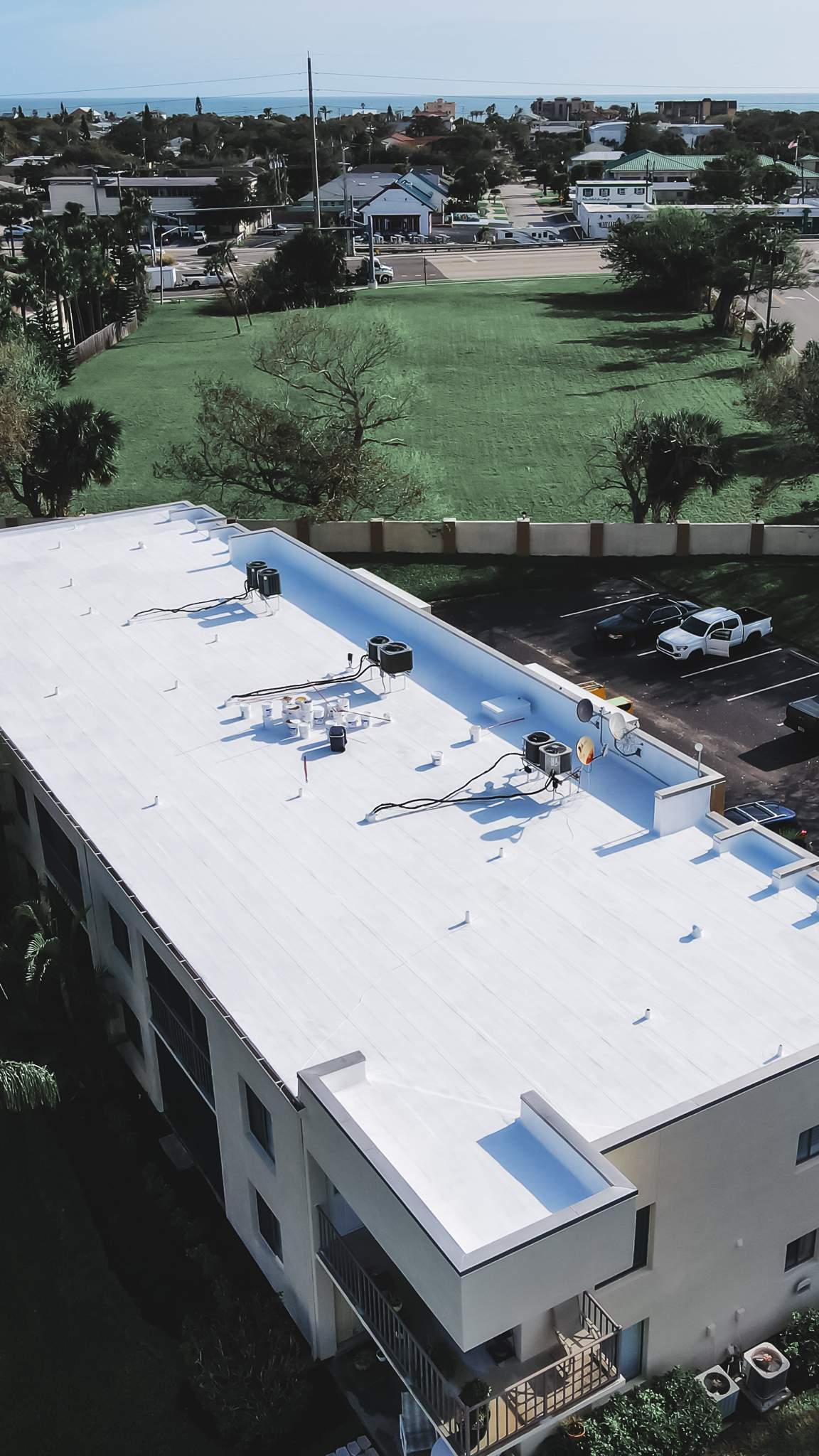 Multi-Building Flat Roof Replacement at Cape Canaveral Condominiums by Wiedmann Construction & Roofing