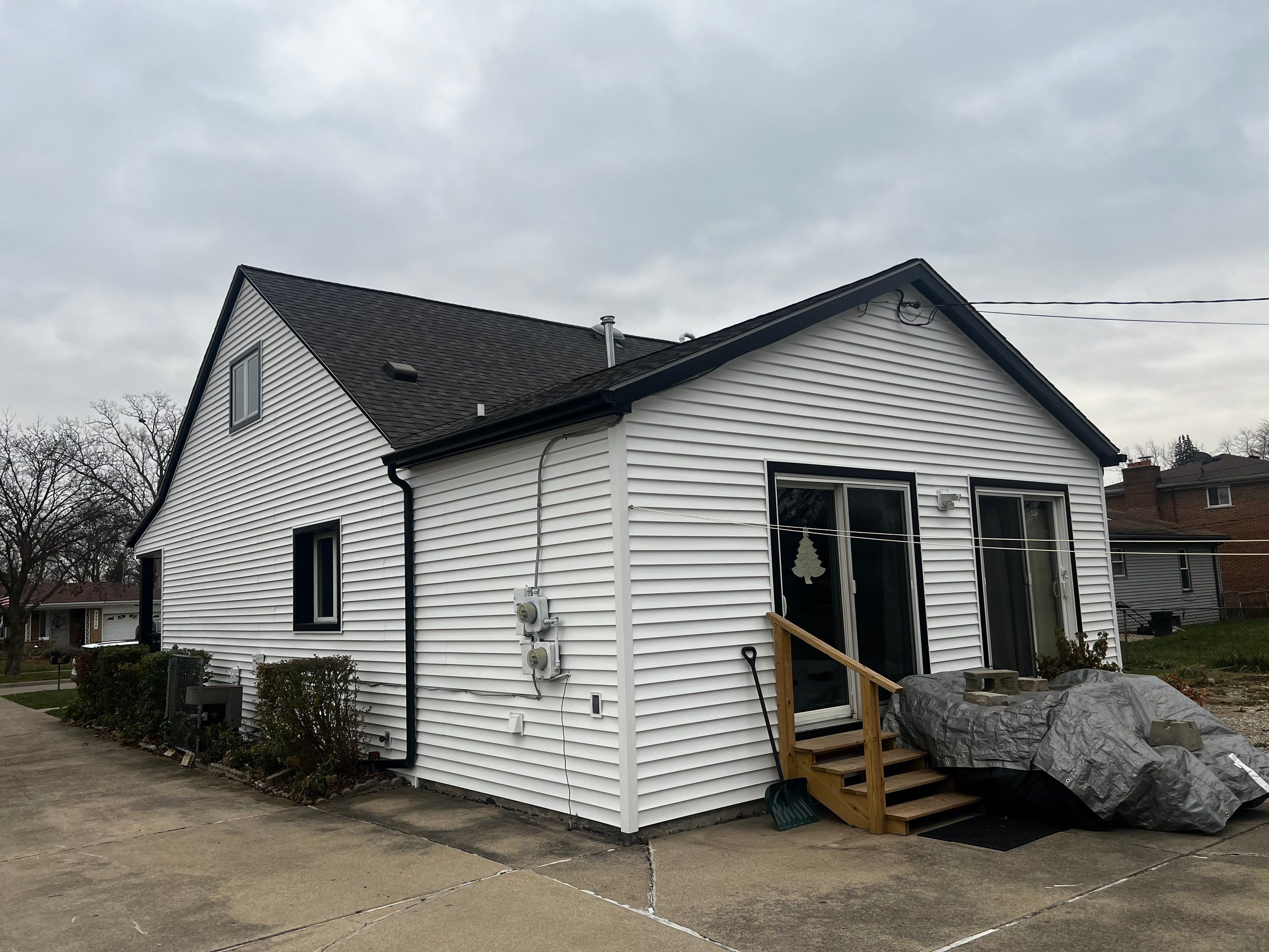 Siding Replacement using CertainTeed Monogram vinyl in Colonial White & Front Porch Remodel by Bloomfield Construction & Restoration