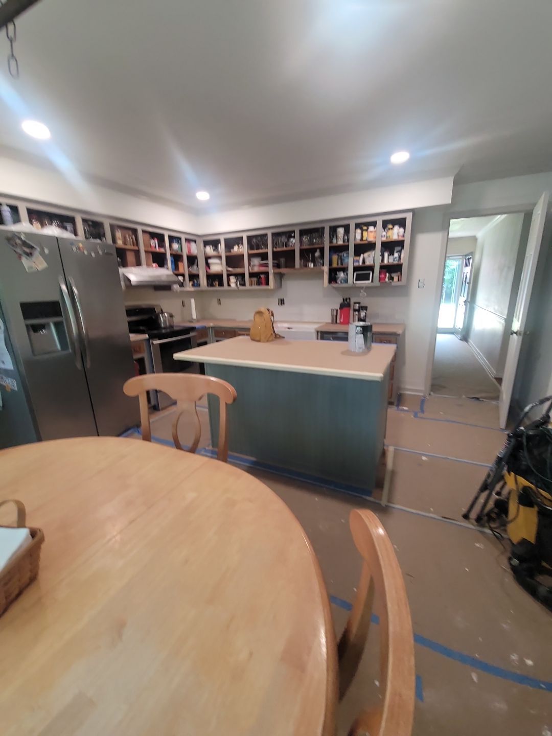 A Pathway to Personality – A Two-Tone Kitchen Transformation in Apex by Elite Remodeling and Design LLC