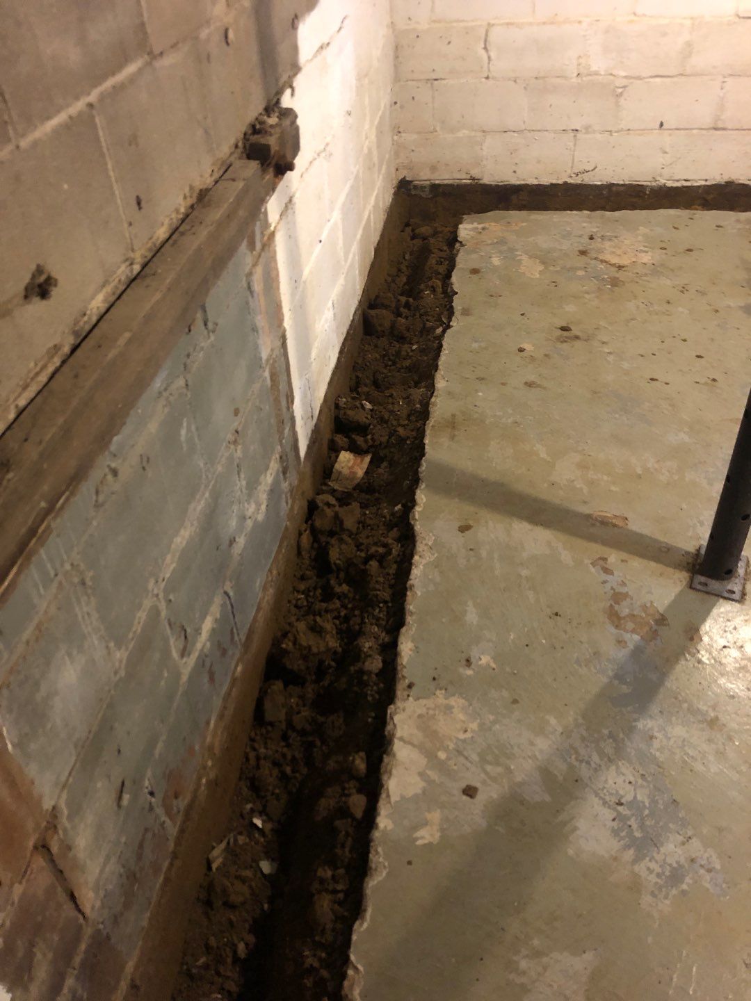 Basement Waterproofing using Drain tile system and a foundation wrap by ACE Waterproofing & Basement Solutions