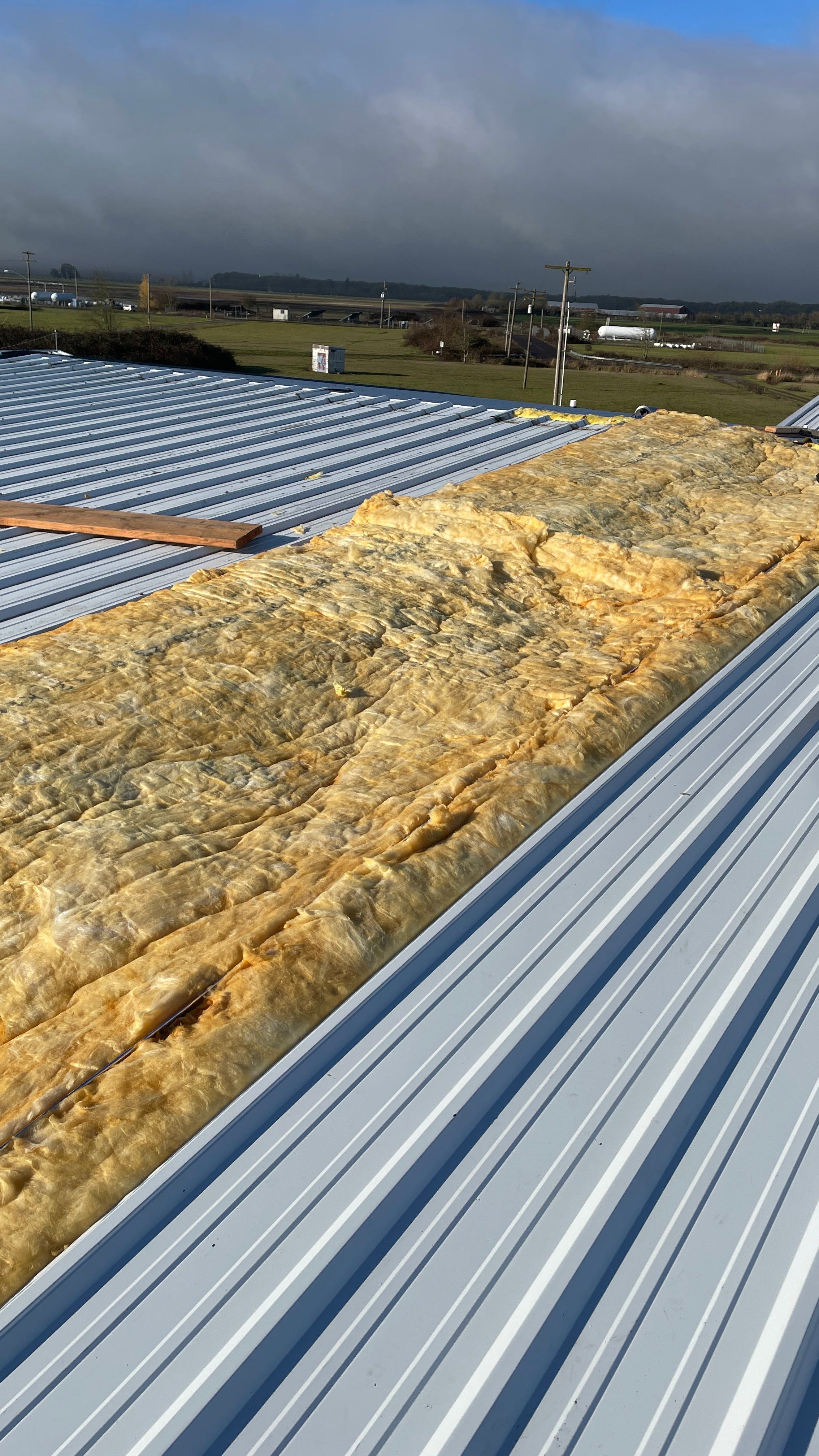 Airport Hanger Metal Roof Replacement and Insulation by Villegas Remodeling, LLC