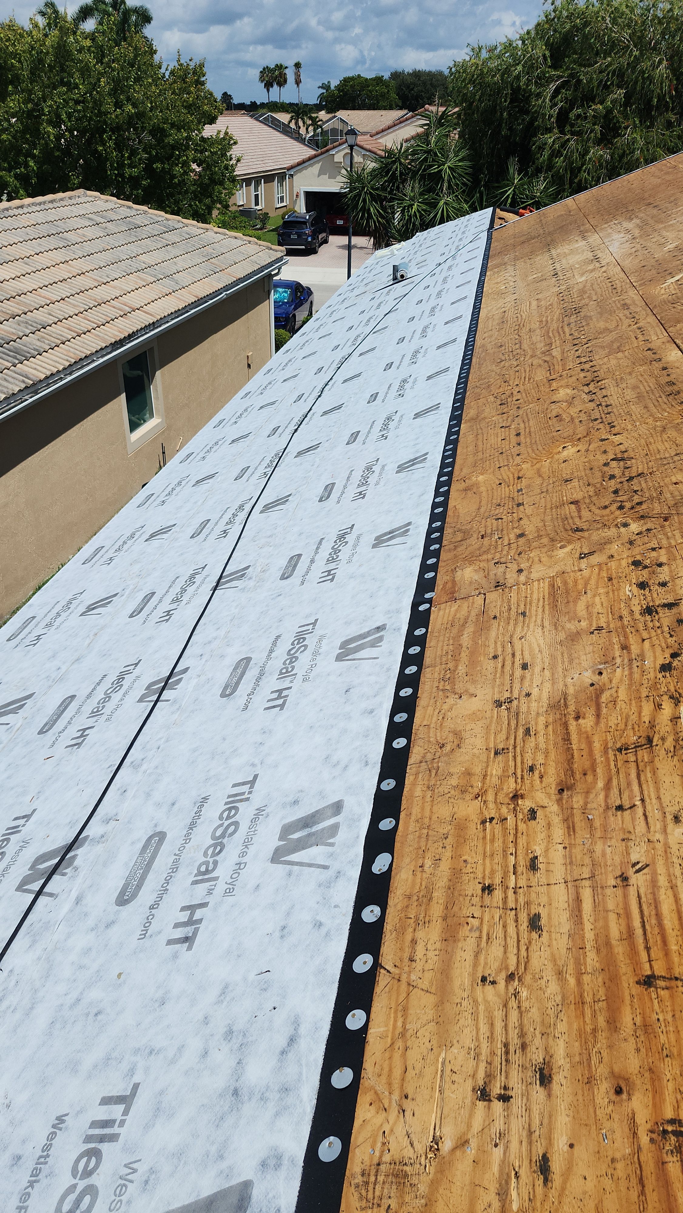 Tile Roof Replacement and Sheathing Repair in Boynton Beach by Aastro Roofing