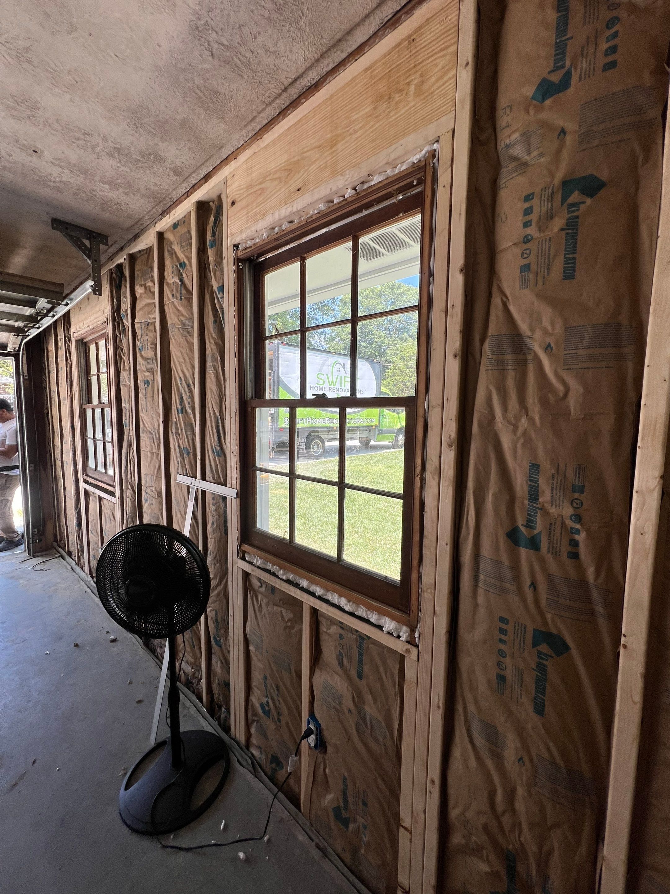 Snellville Garage Remodel Featuring Epoxy Floors and Board and Batten Siding by Swift Home Renovations