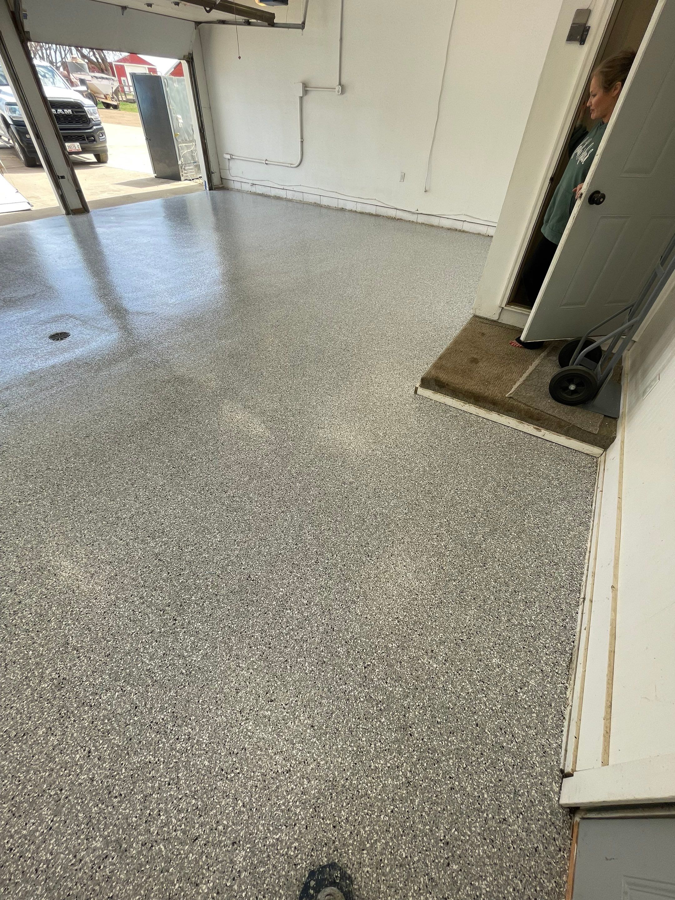 Feather Grey Garage Floor Coating and Crack Repair in Beresford by Select Painting, Coatings & Garage Cabinets