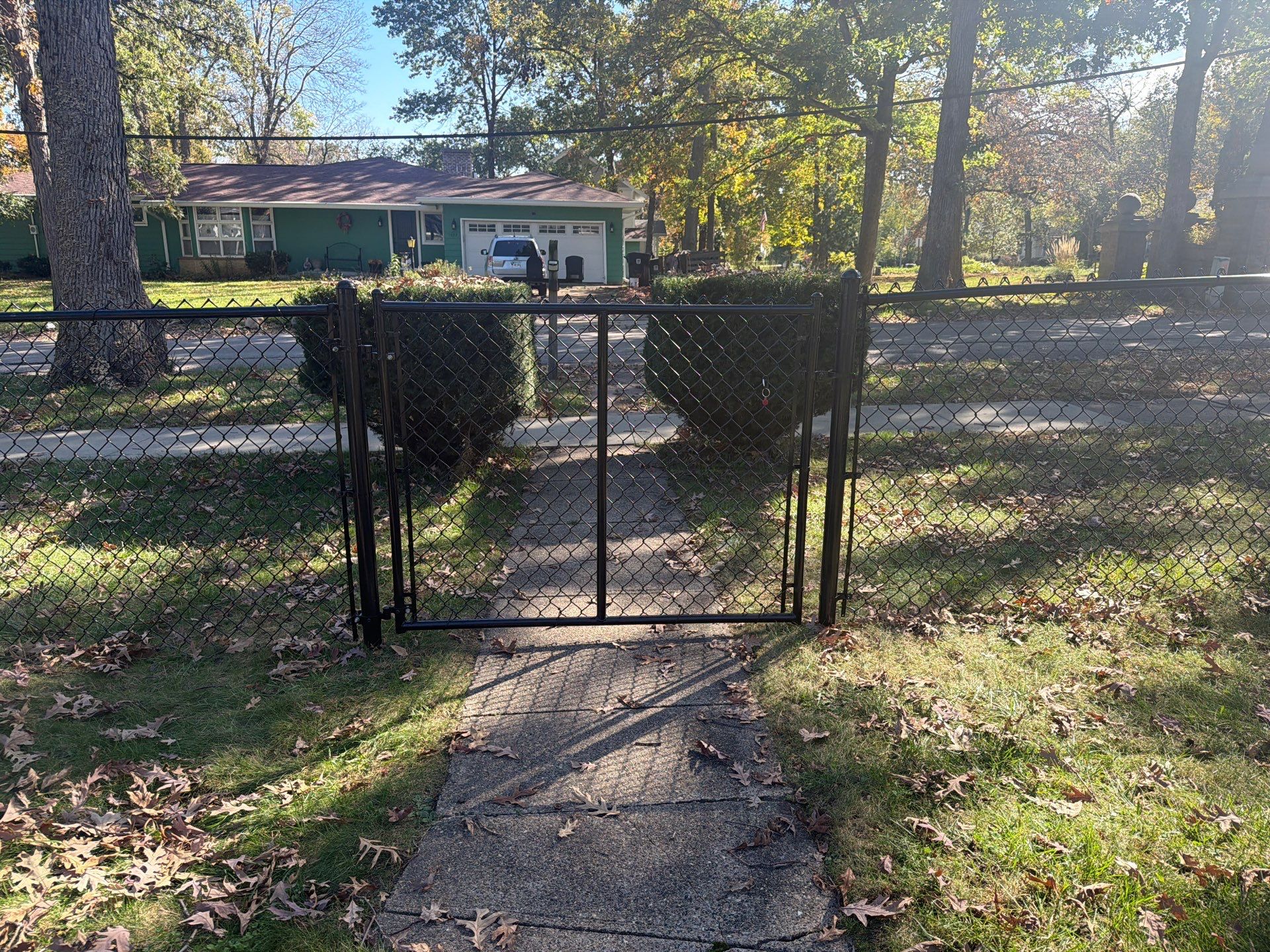 Residential Black Chain Link Fencing in Cedar Falls by Perfect Picket Fence and Stain