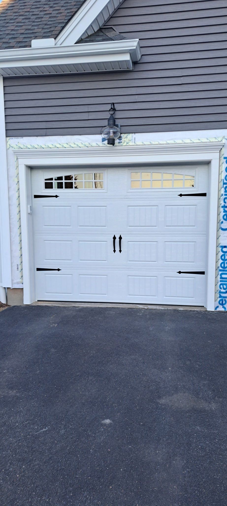 Garage Door Upgrade with Classic Style & Window Accents by DiGiorgi Roofing and Siding Inc